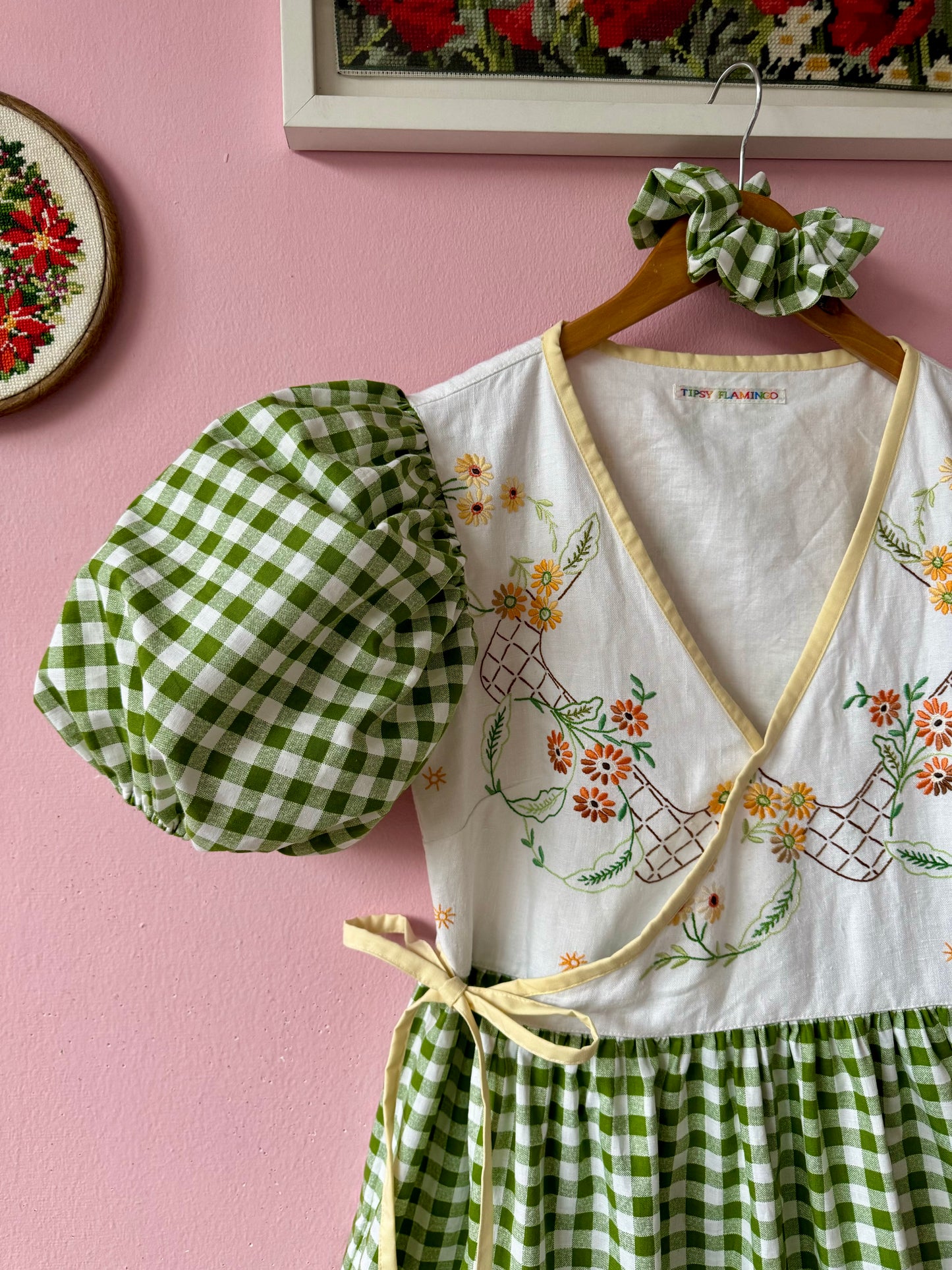 Wrap around dress with green gingham and embroidery