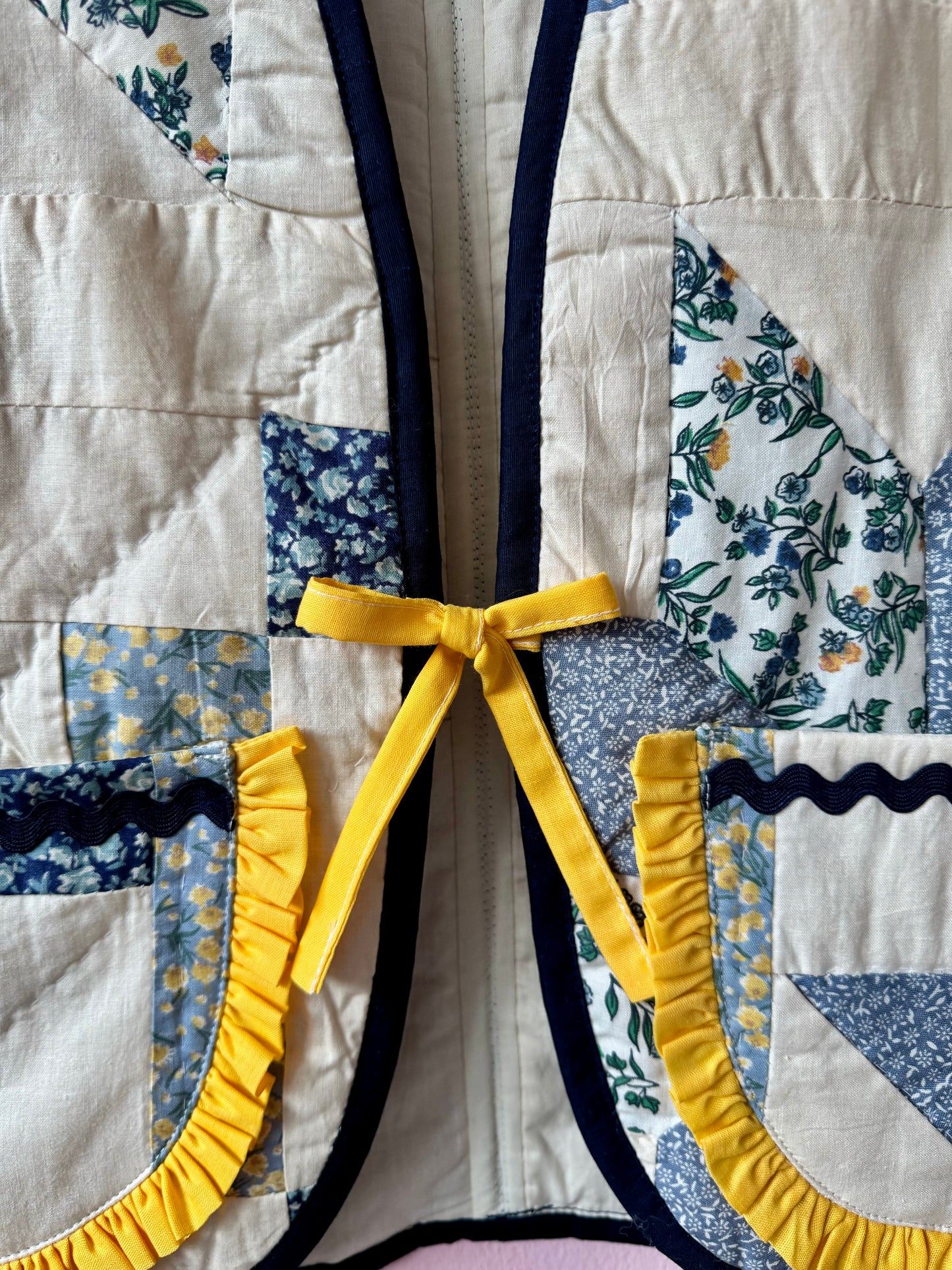 Blue/white vest with yellow trim