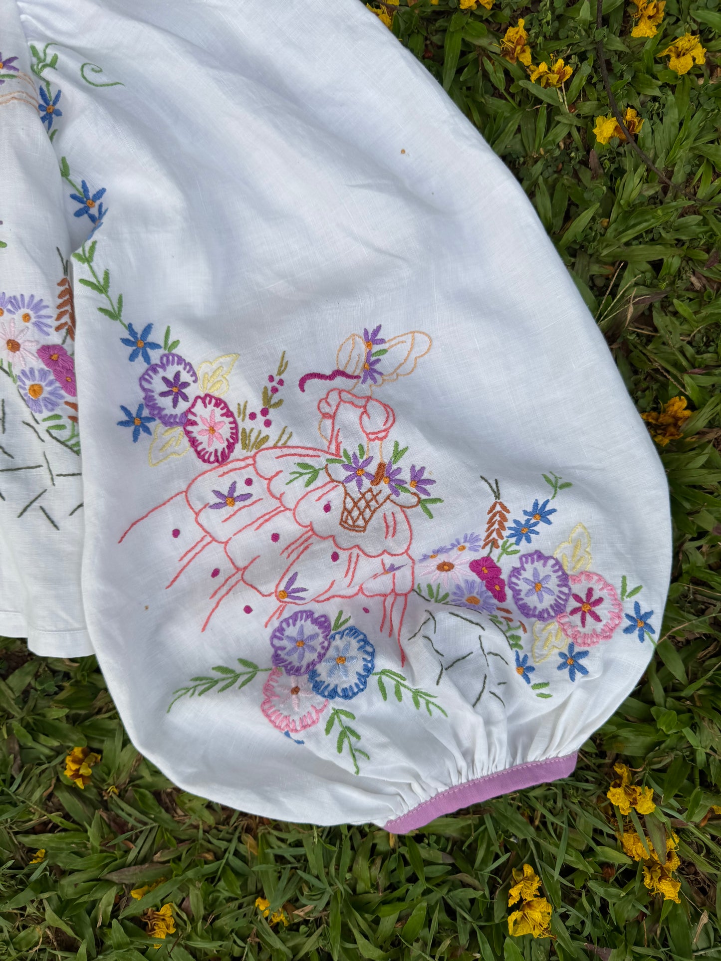 Blouse with lace neckline and lilac trimming