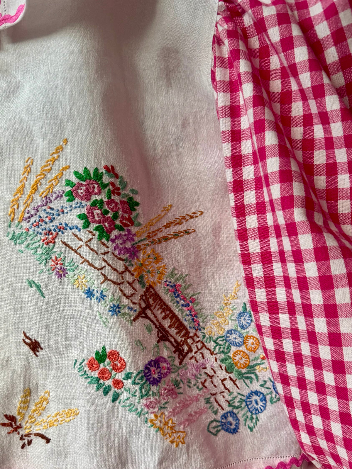 Pink gingham and floral blouse with neckline frill
