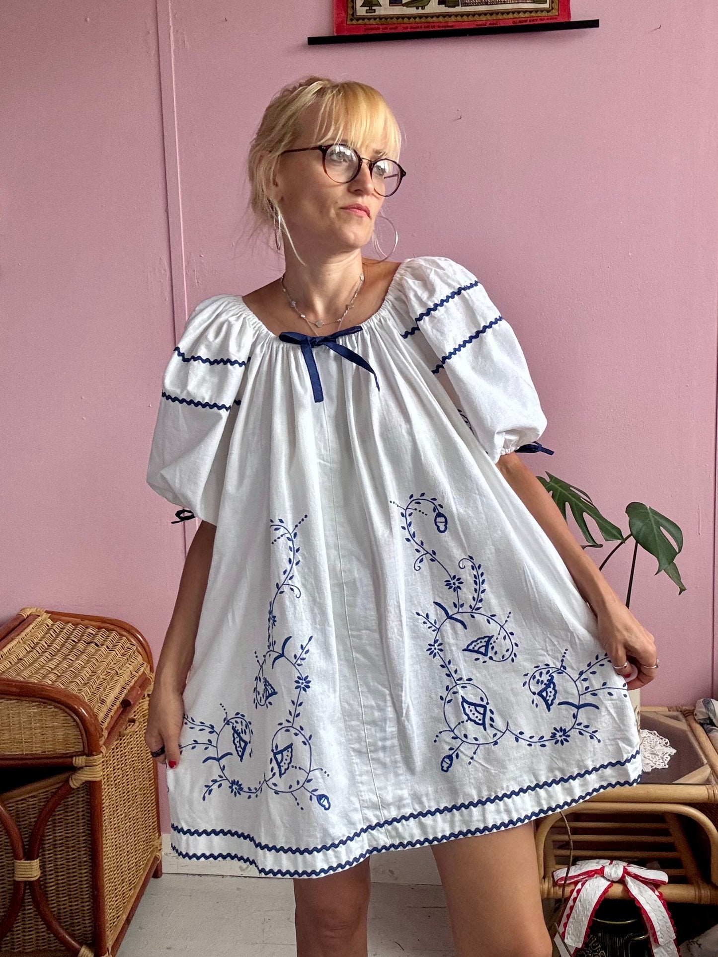 White mini dress with blue embroidery and blue bows