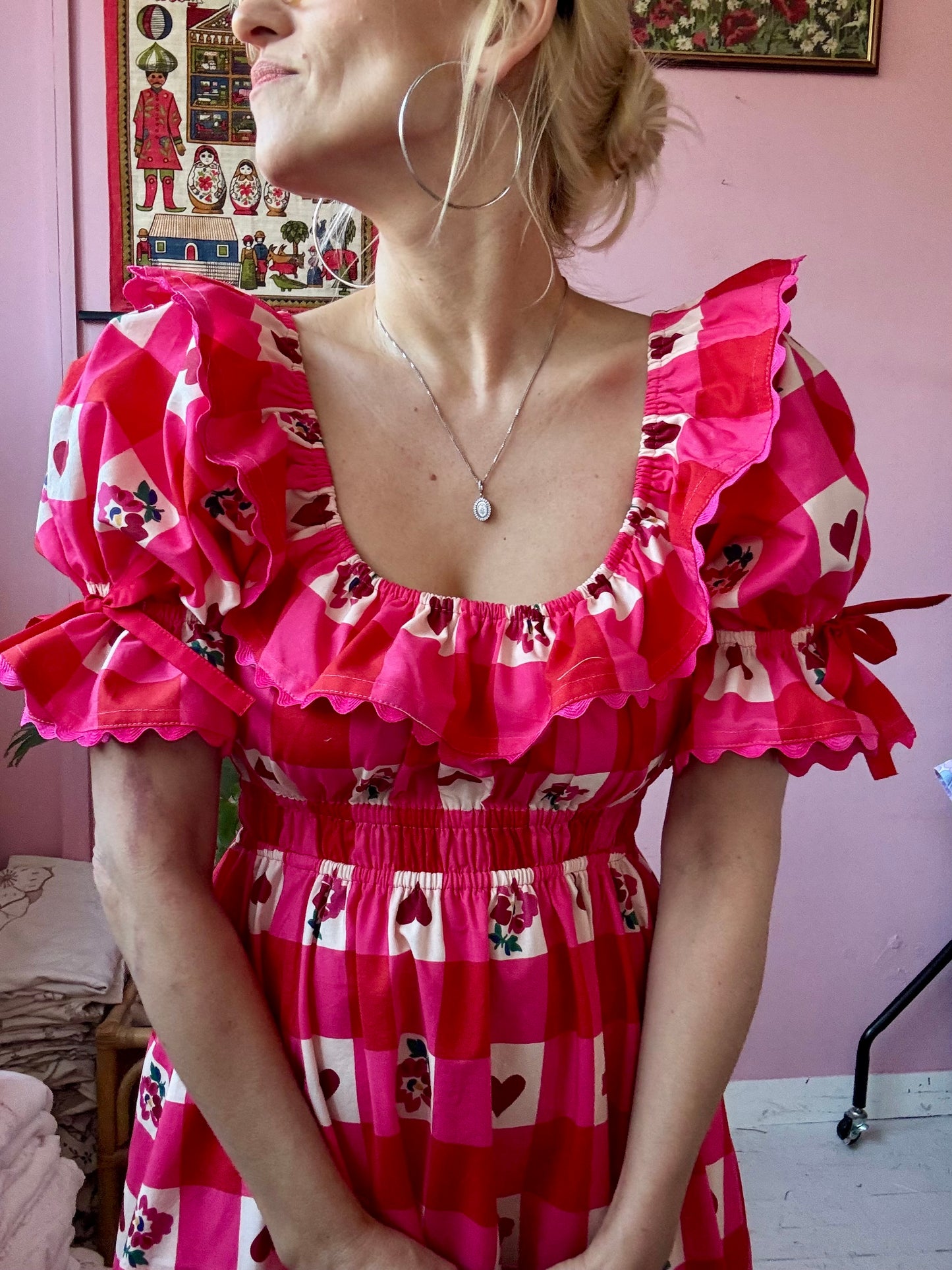 Pink/red dress with frills and ric rac