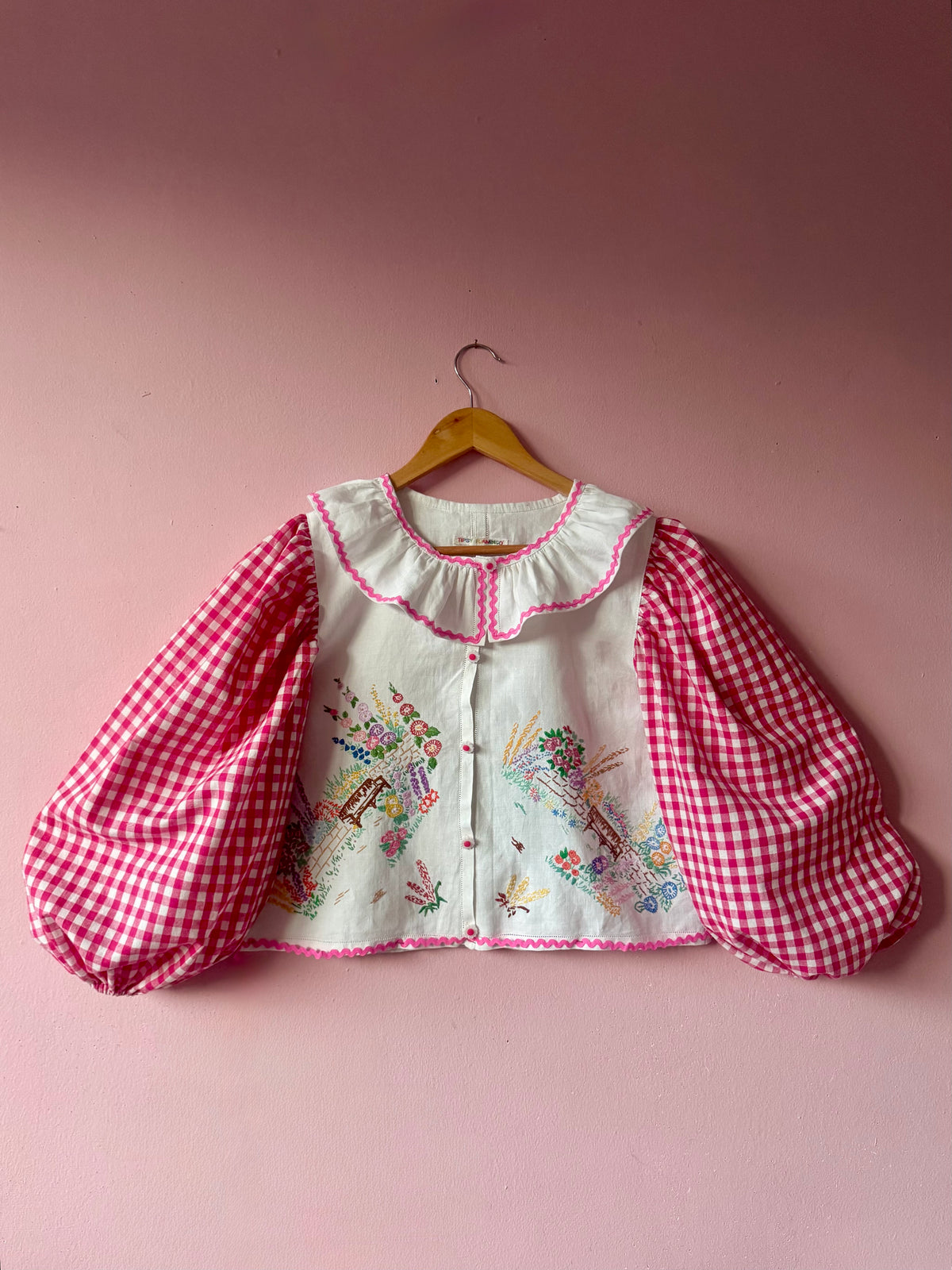 Pink gingham and floral blouse with neckline frill