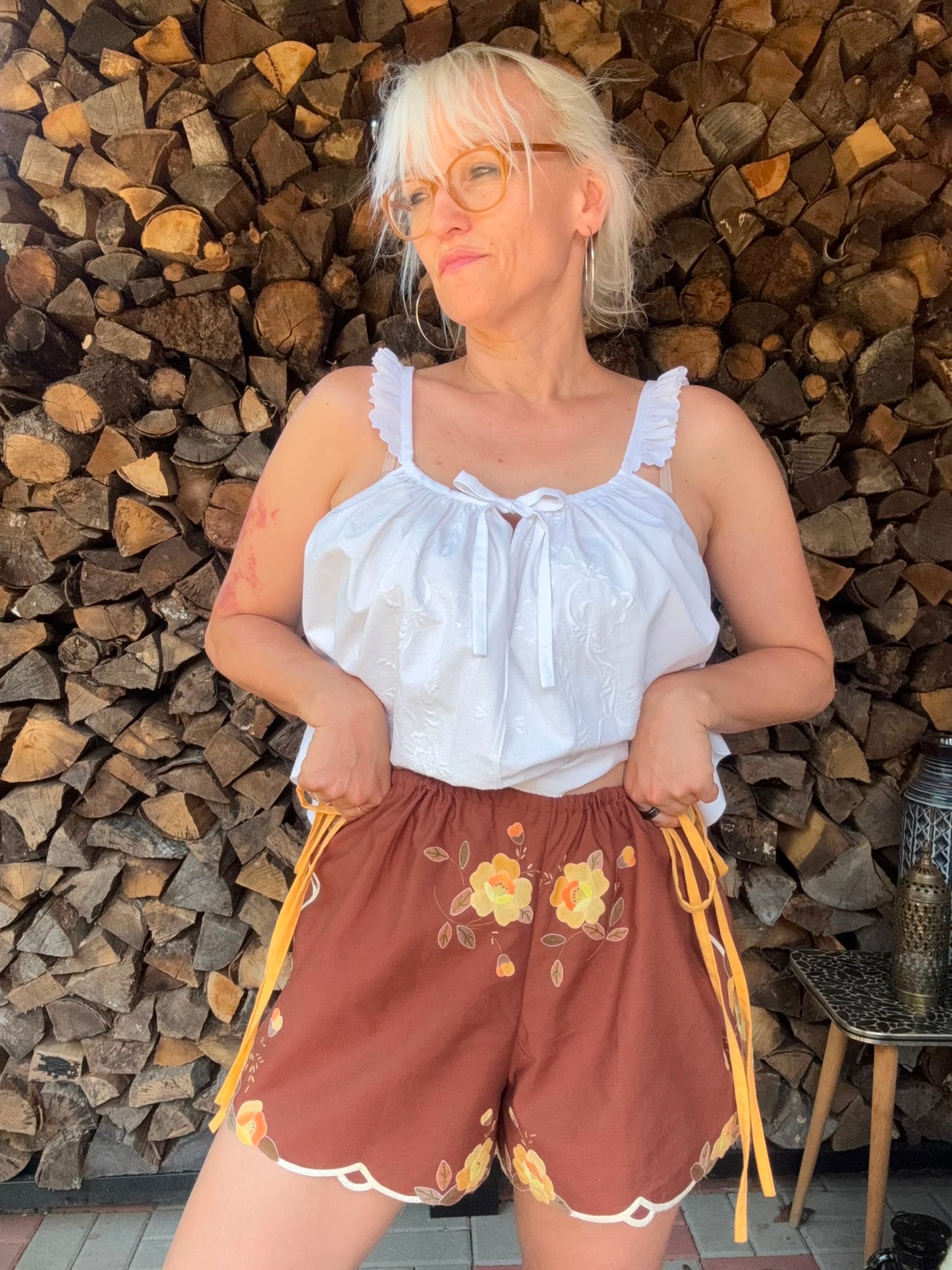Brown shorts with yellow side straps
