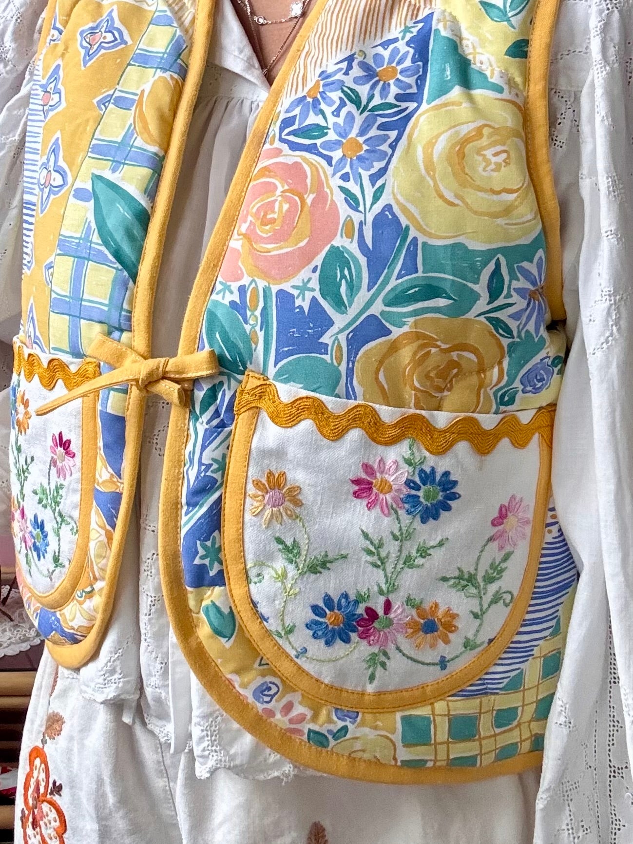 Floral vest with yellow binding