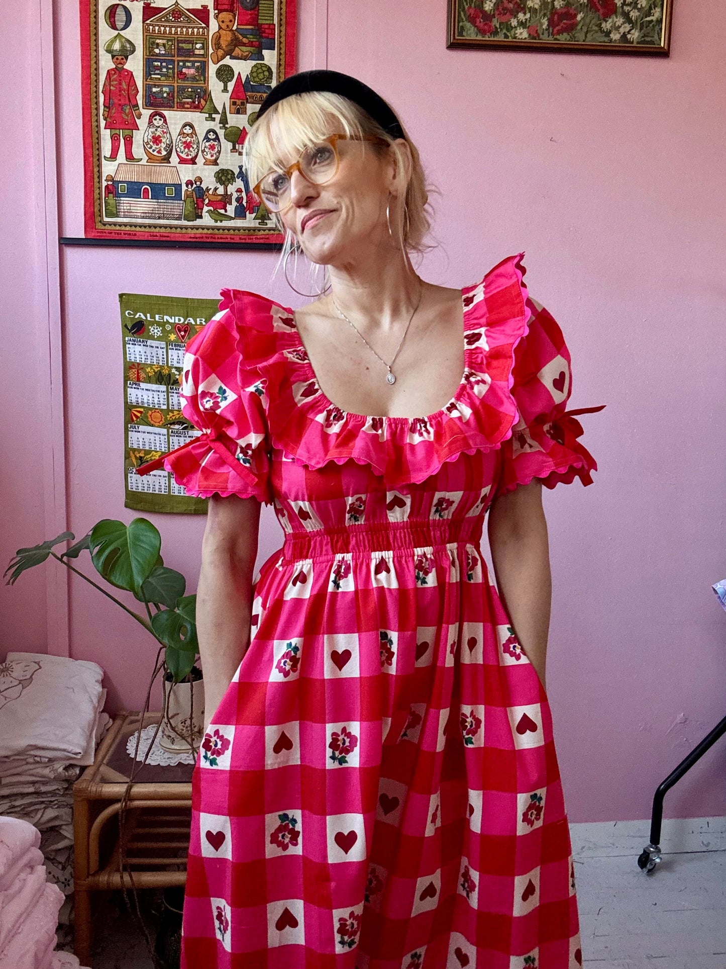 Pink/red dress with frills and ric rac