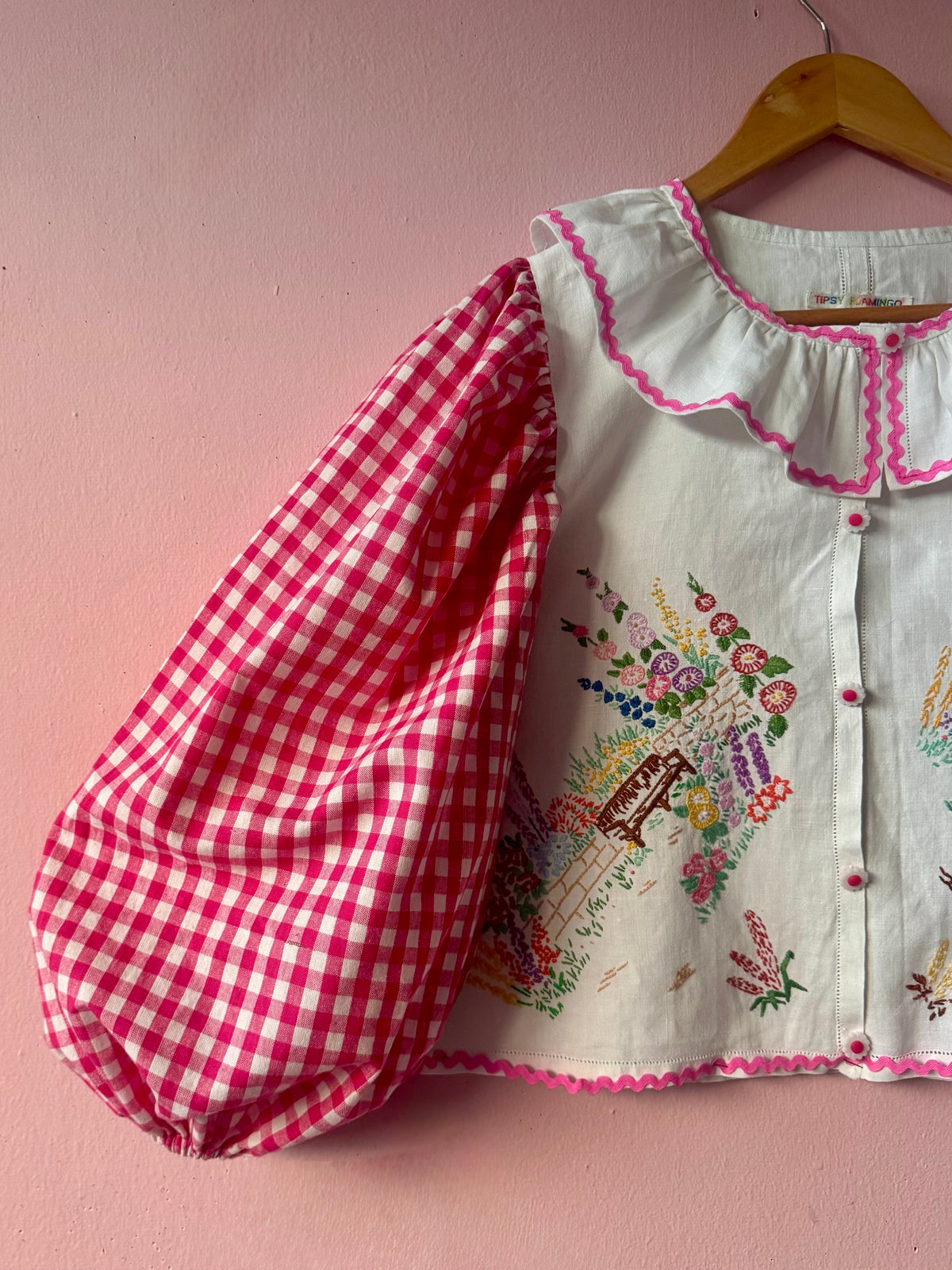 Pink gingham and floral blouse with neckline frill