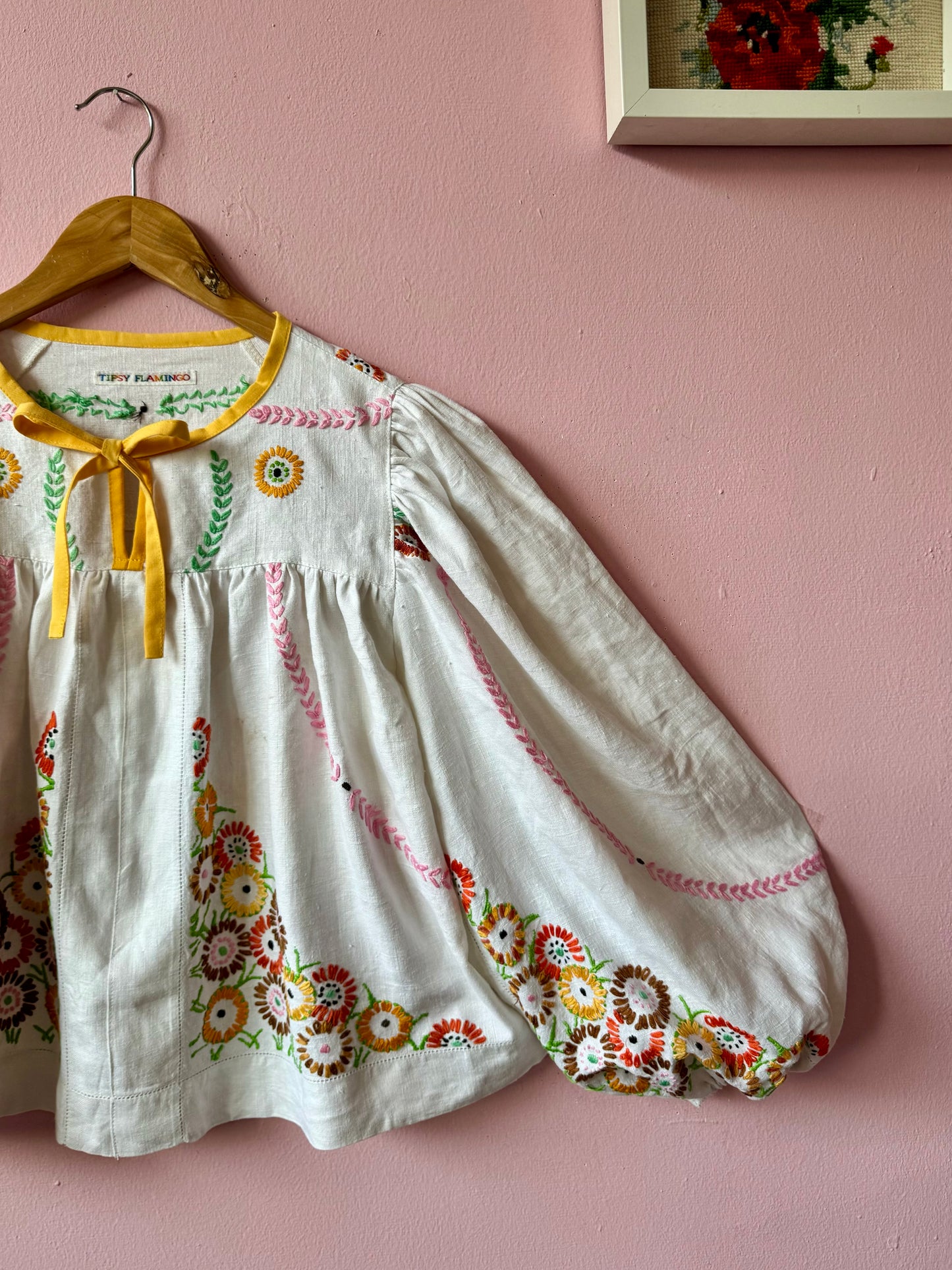 Linen blouse with floral embroidery and yellow binding