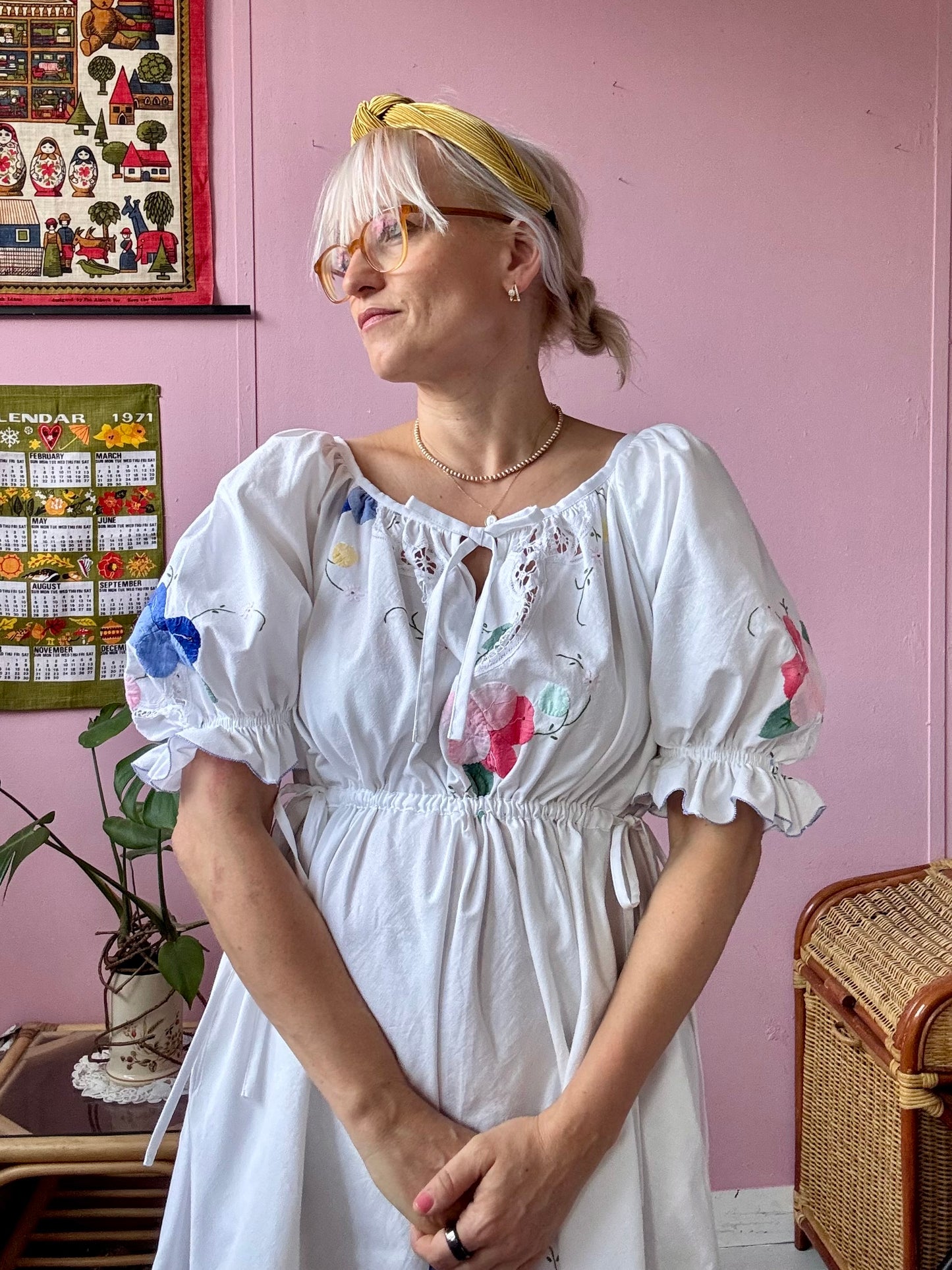 White mini dress with floral appliqués