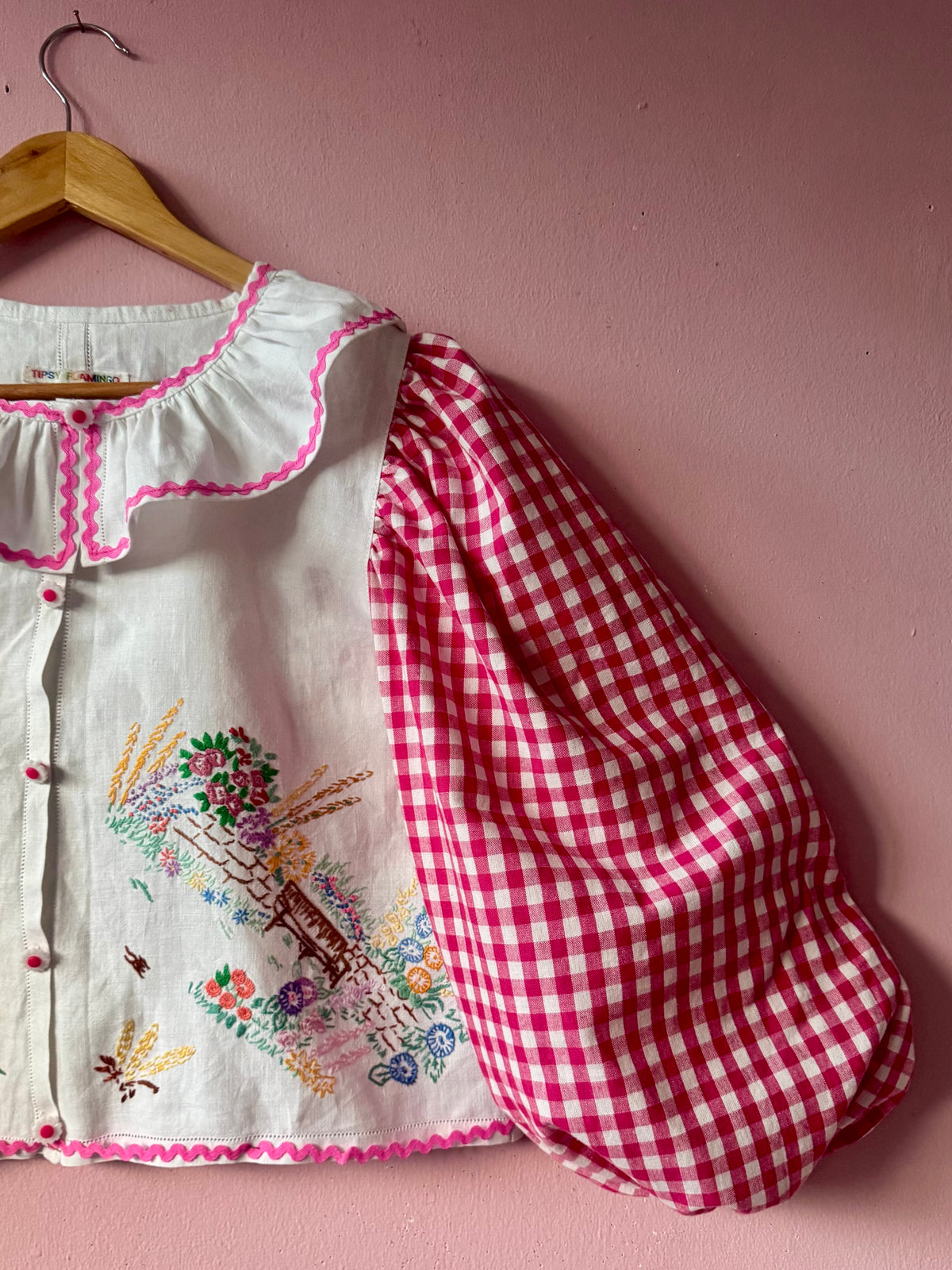 Pink gingham and floral blouse with neckline frill