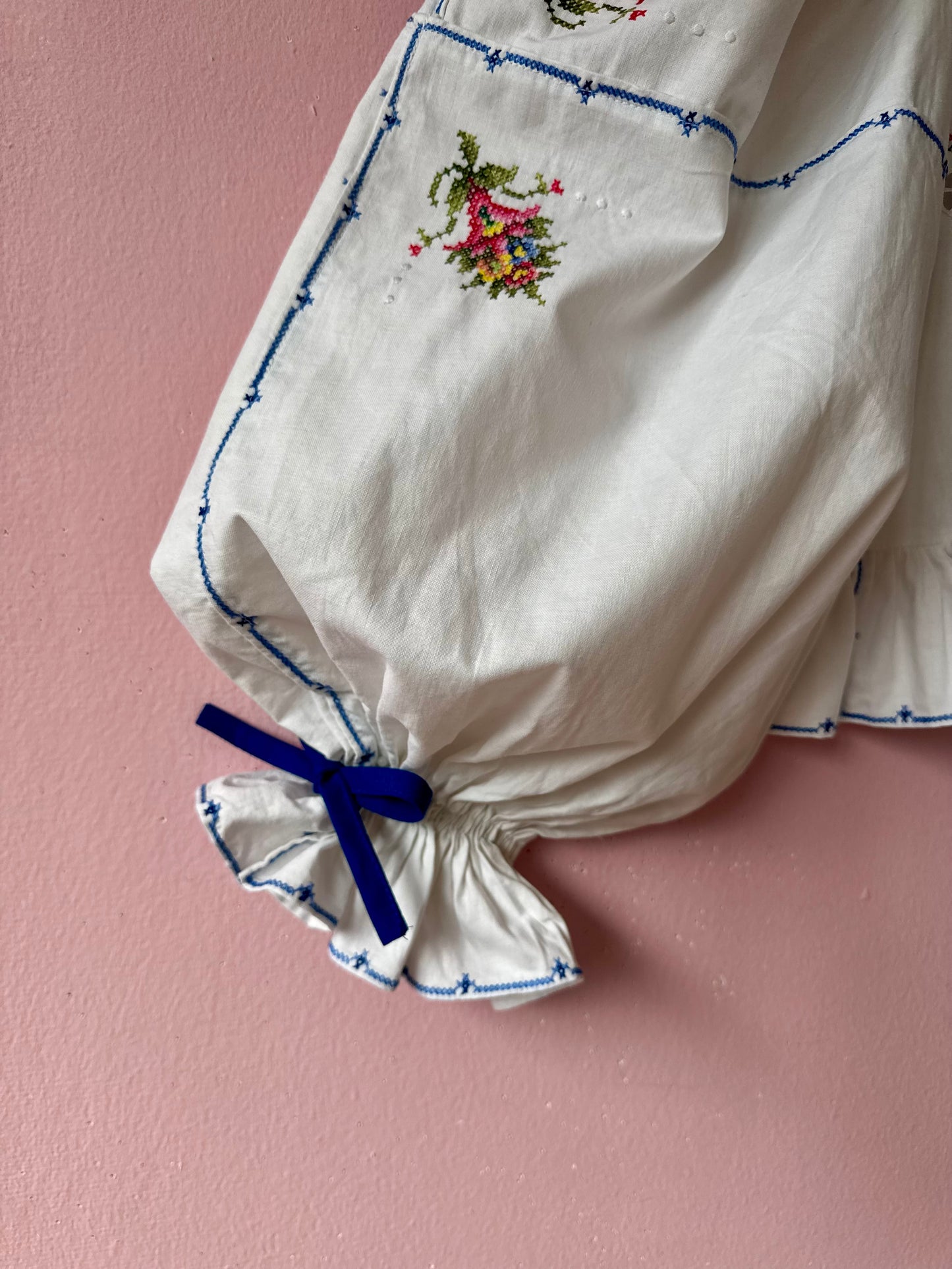 White embroidery blouse with blue bows