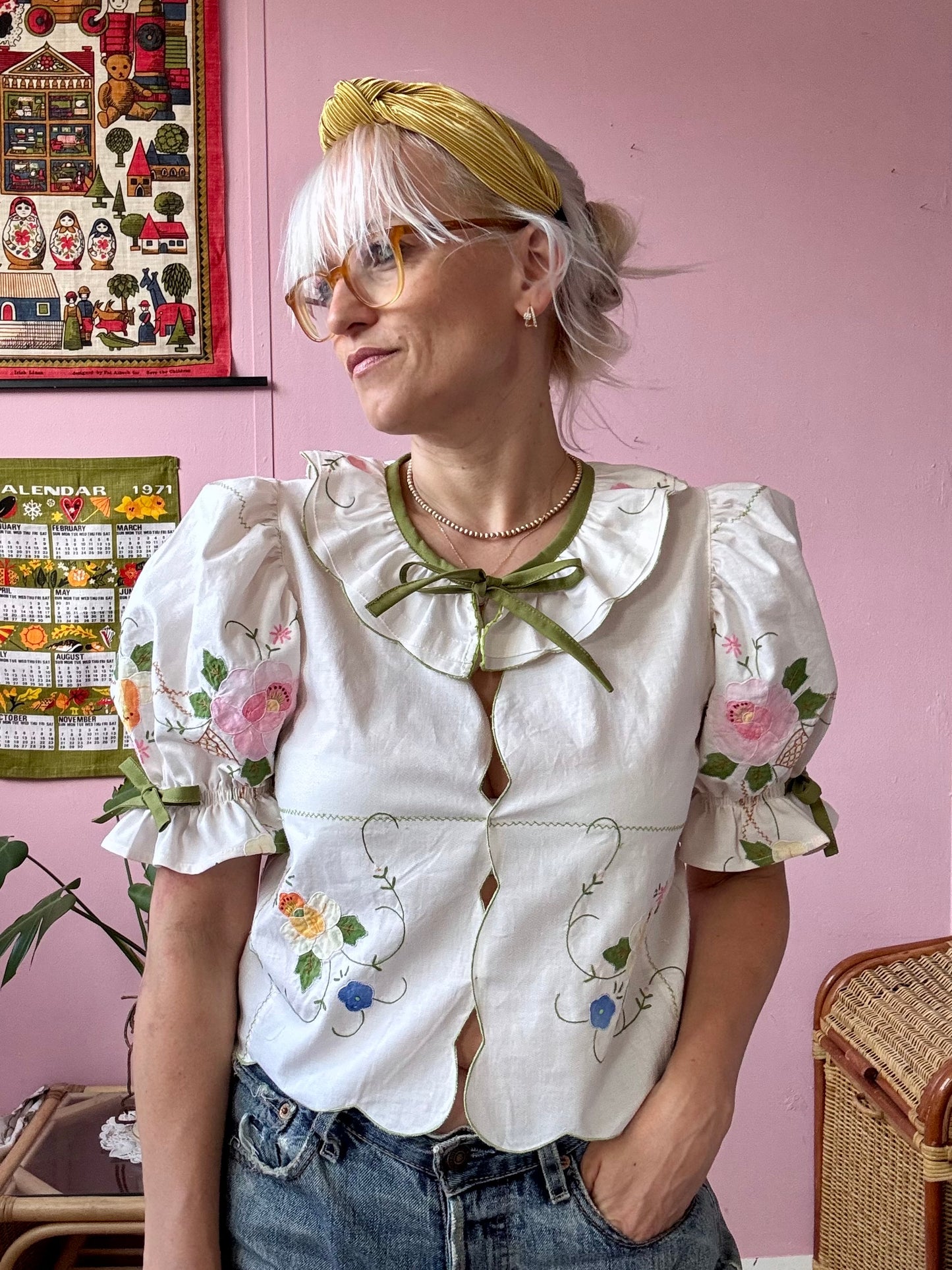Cream blouse with floral appliqués