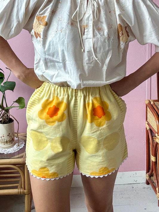 Yellow floral shorts with ric rac