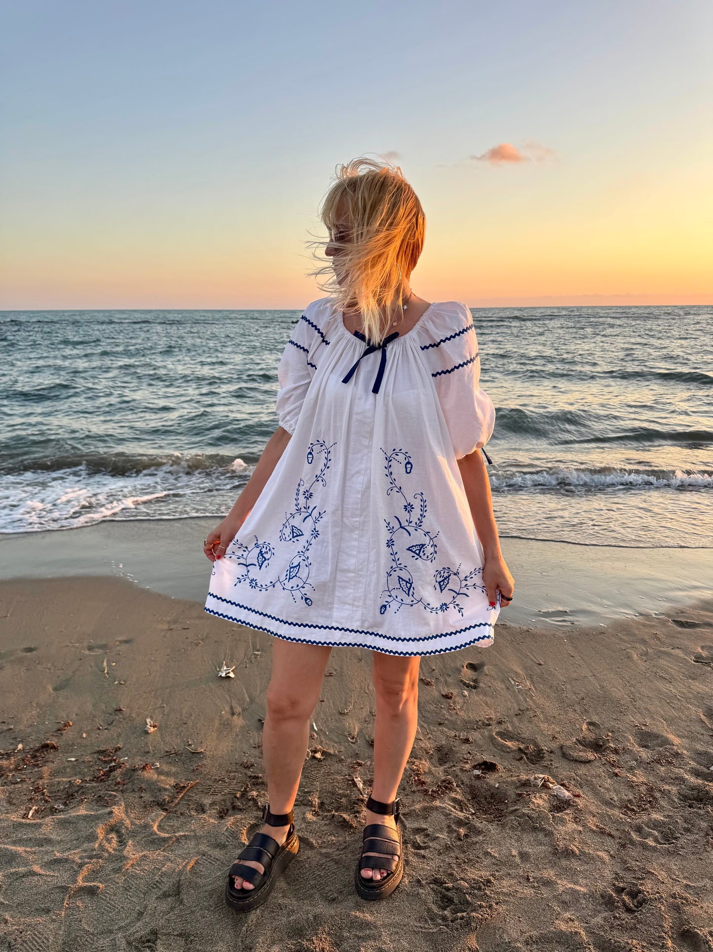 White mini dress with blue embroidery and blue bows