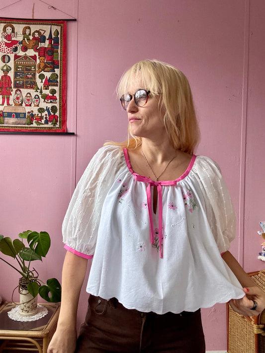 White blouse with pink binding