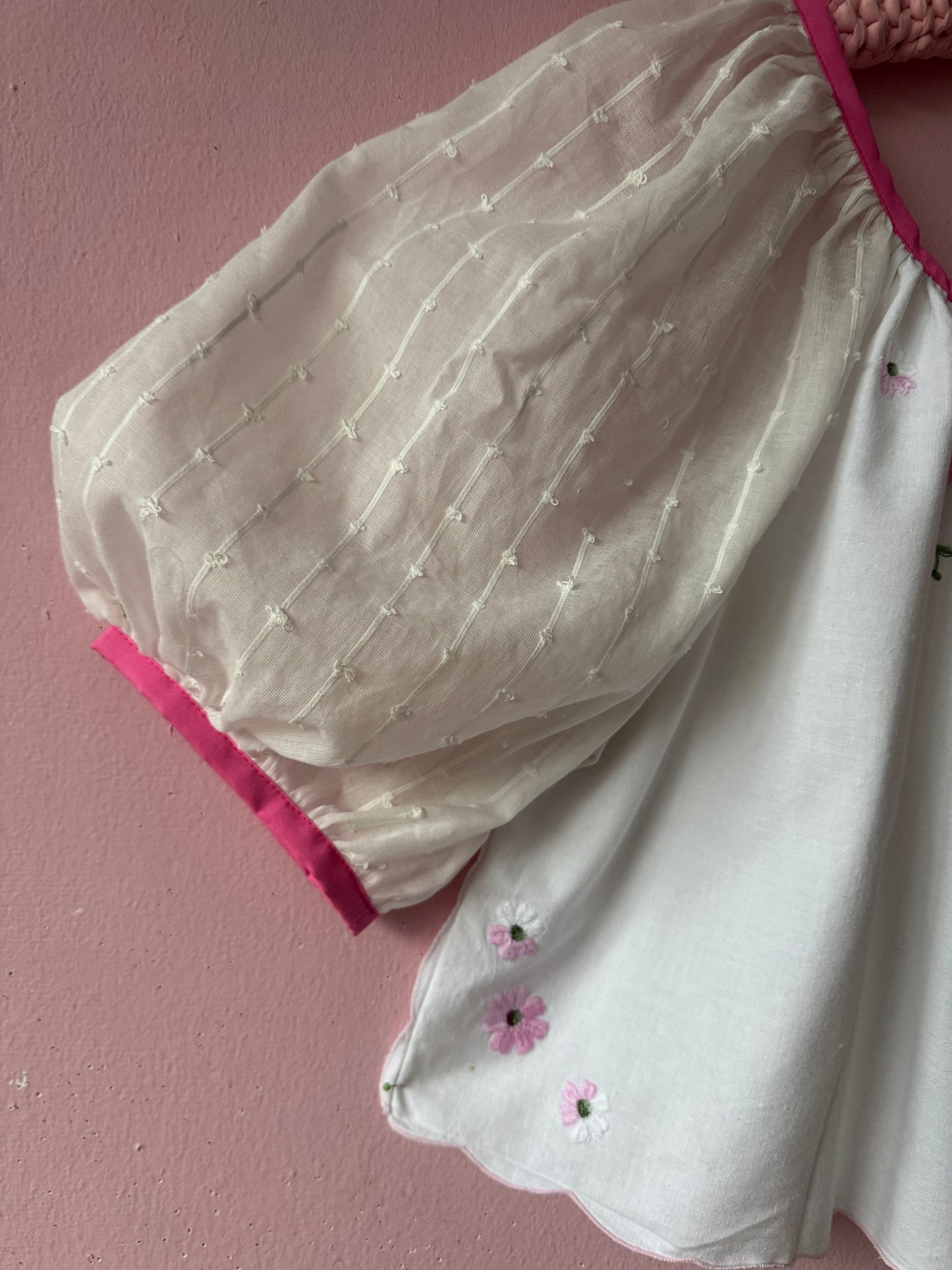White blouse with pink binding