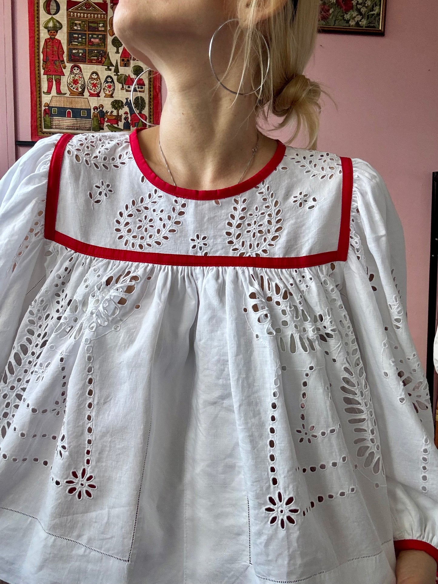 White blouse with red binding