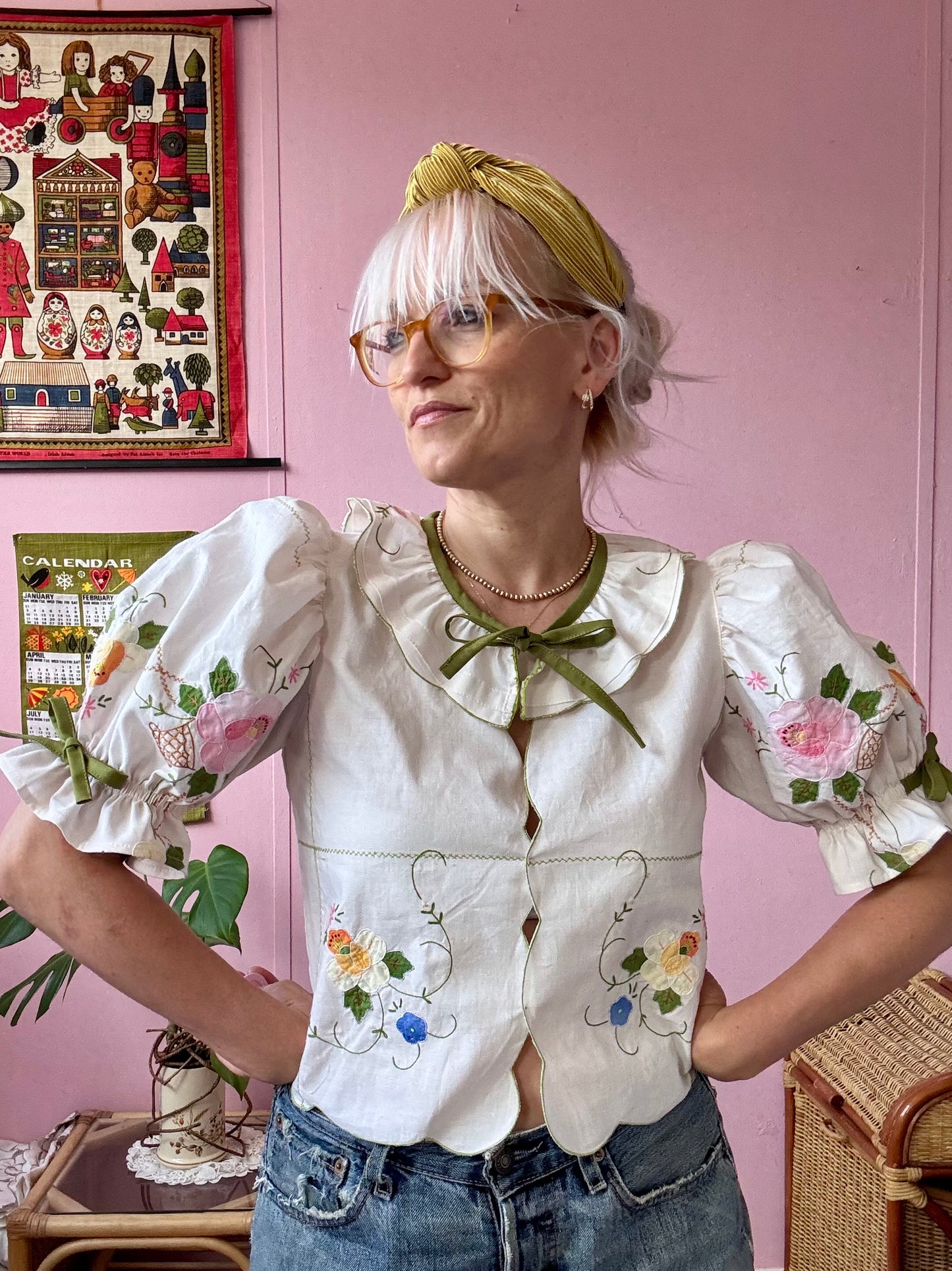 Cream blouse with floral appliqués