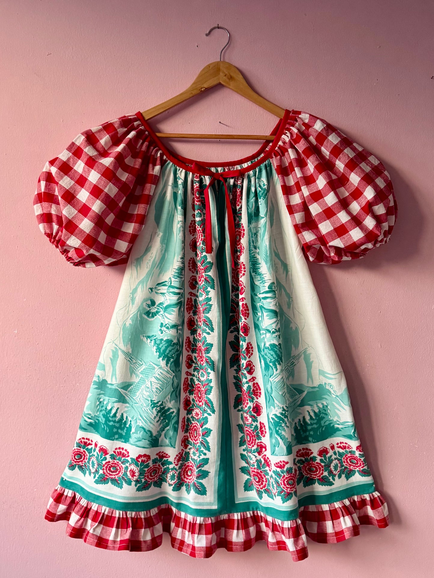 Vintage Tyrol village and red gingham dress