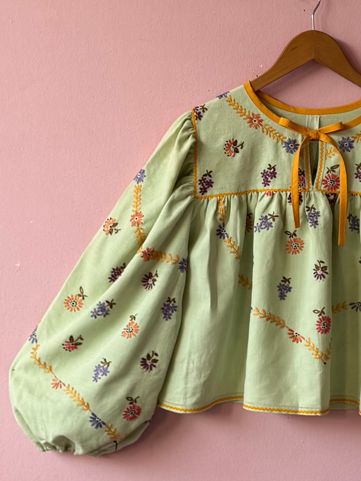 Green blouse with mustard yellow details