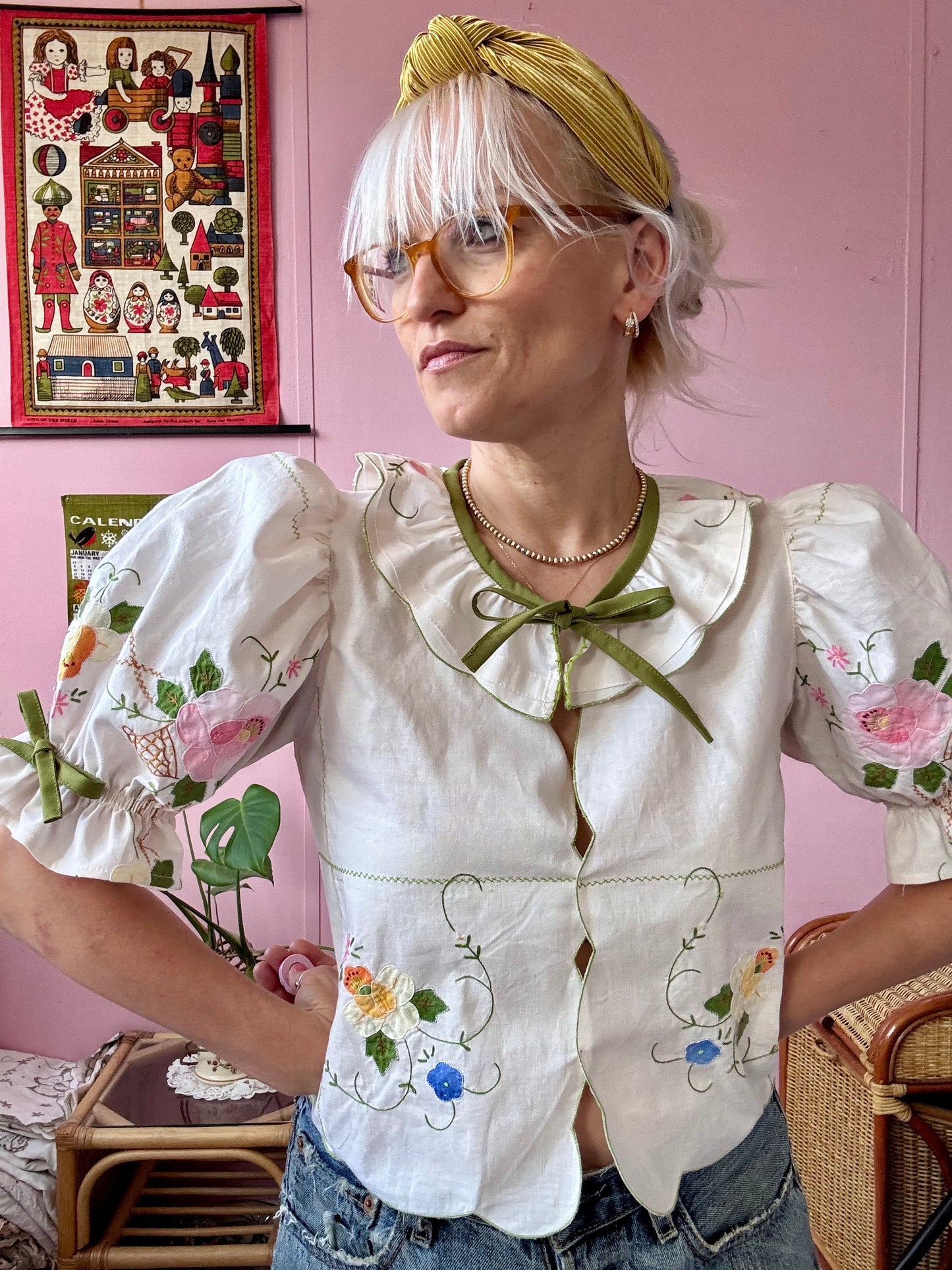 Cream blouse with floral appliqués