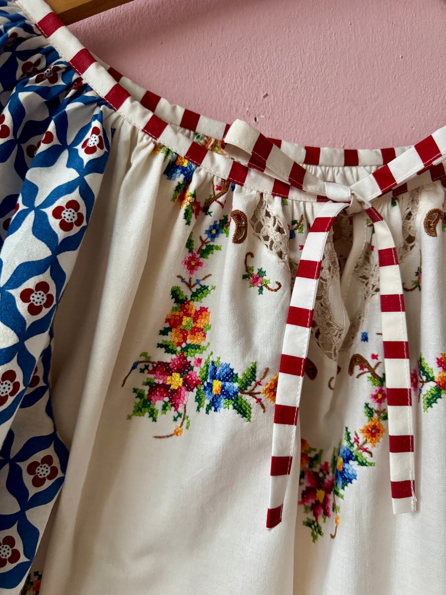 Embroidery and lace blouse with red stripes binding