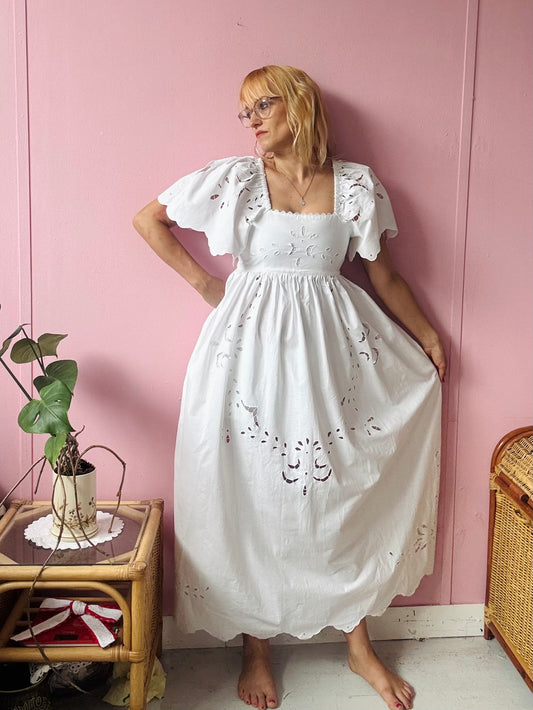 All white maxi dress with cut out embroidery
