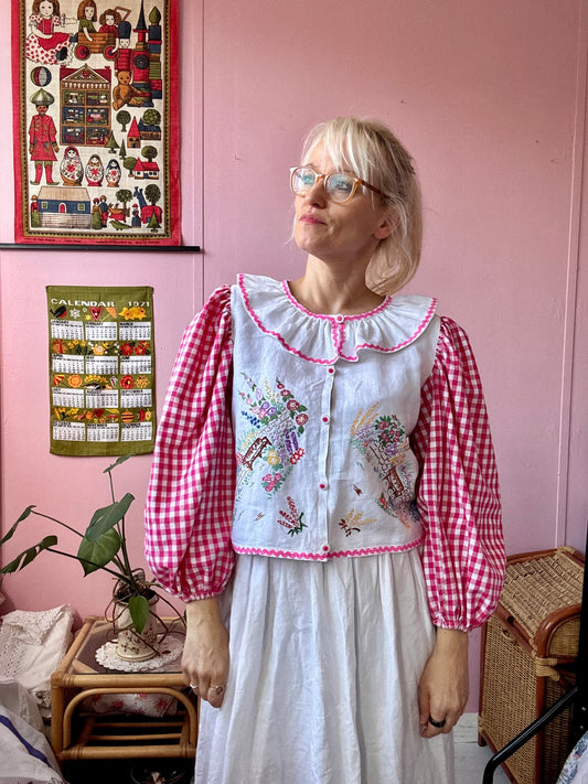 Pink gingham and floral blouse with neckline frill