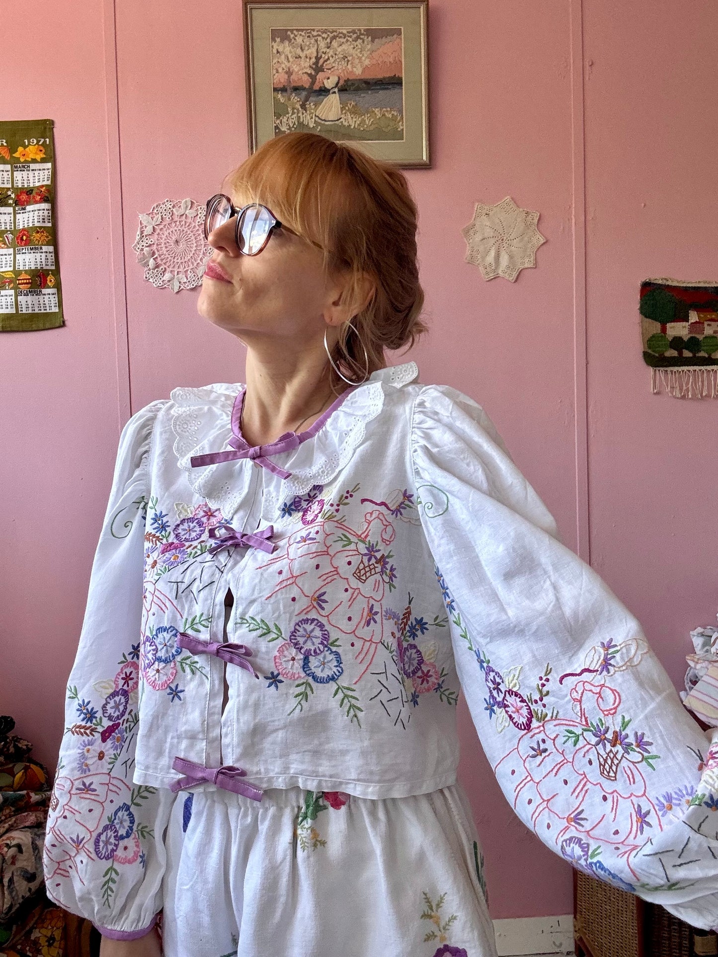 Blouse with lace neckline and lilac trimming