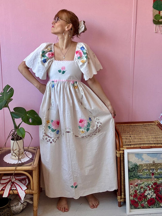 Cream maxi dress with floral appliqués