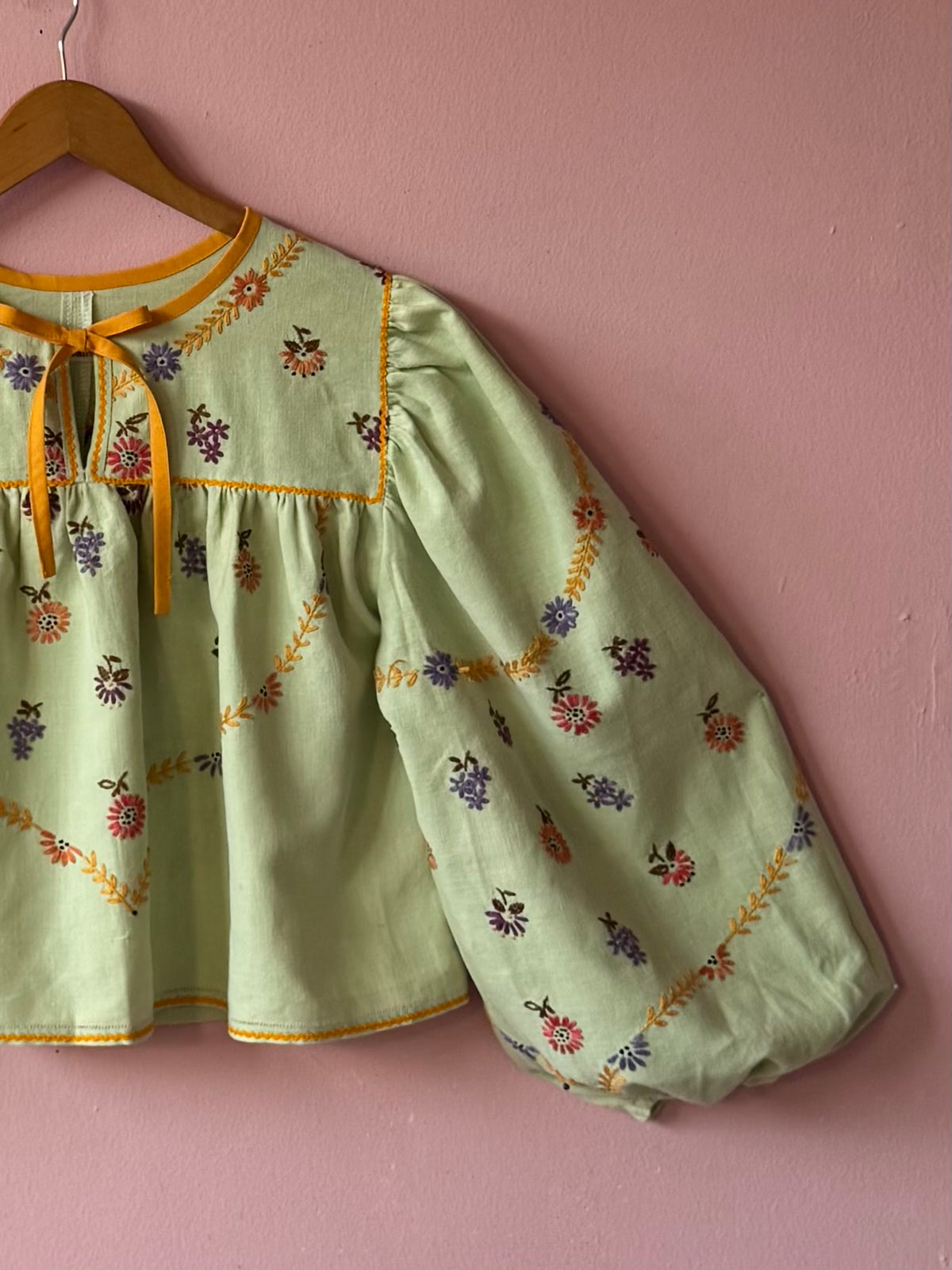 Green blouse with mustard yellow details