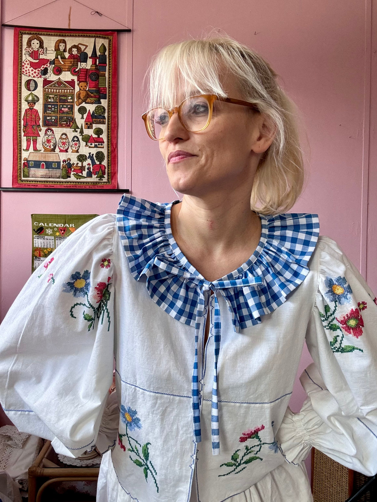 White blouse with blue ric rac neckline frill