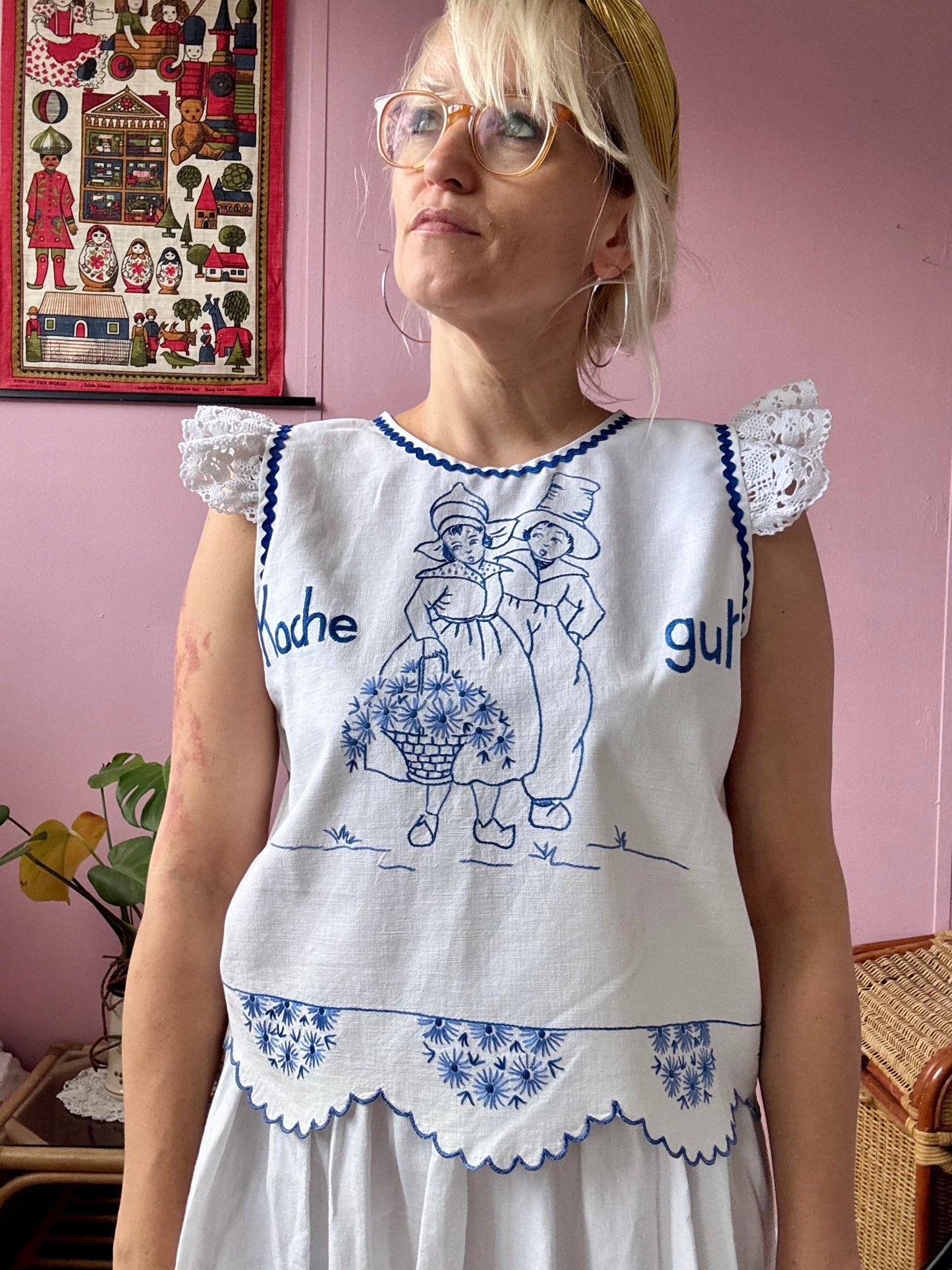White top with blue hand embroidery