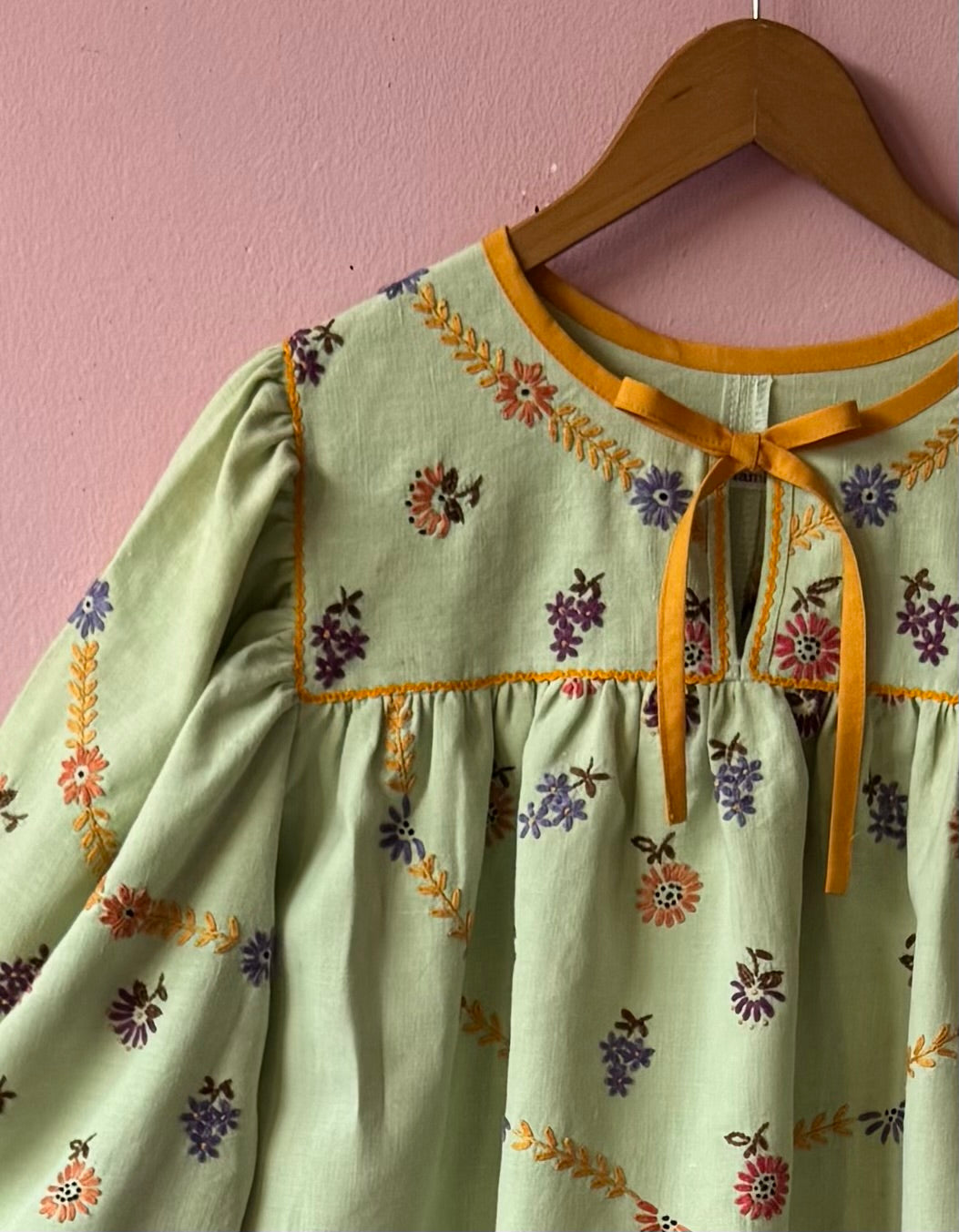 Green blouse with mustard yellow details