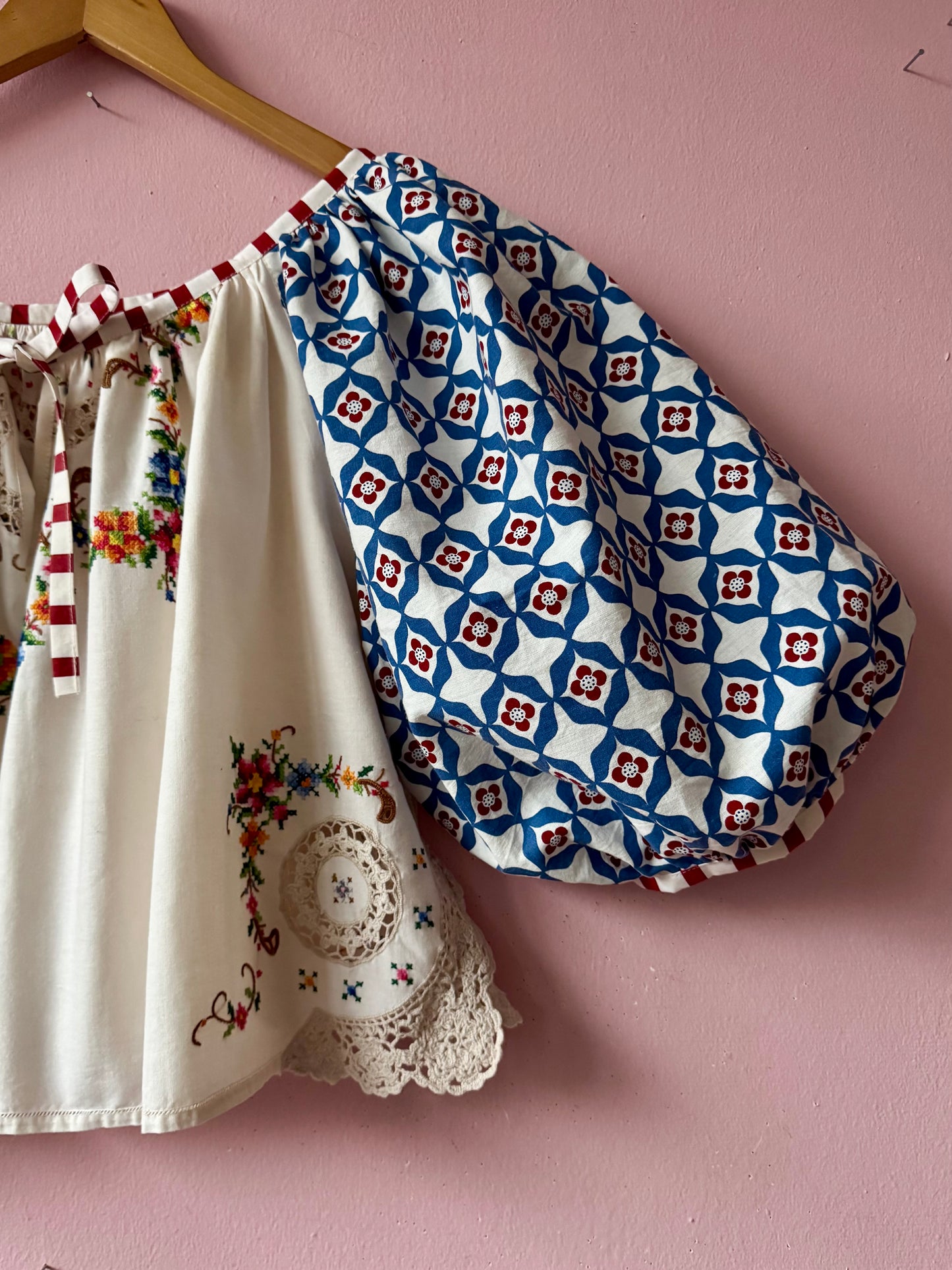 Embroidery and lace blouse with red stripes binding