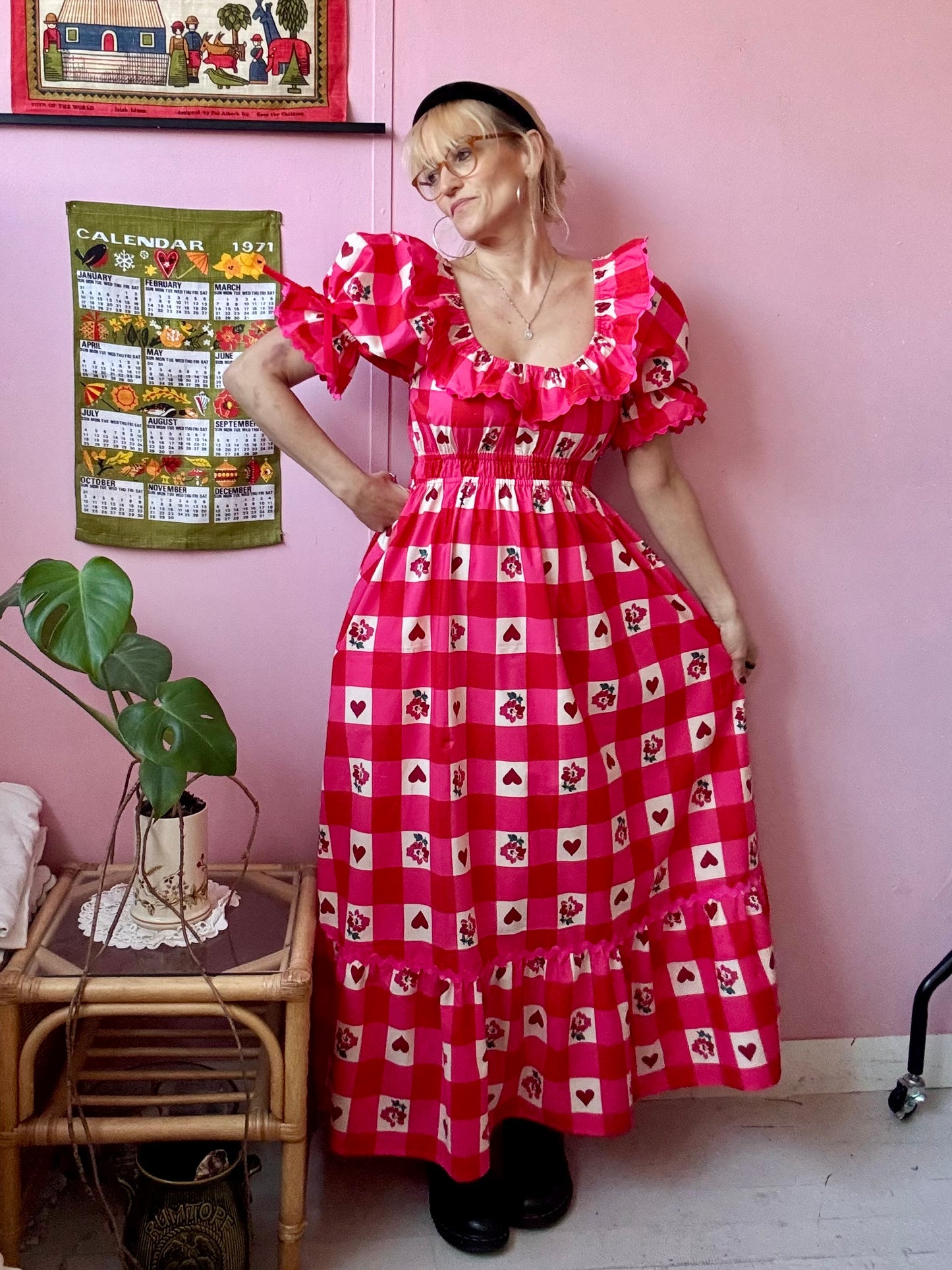 Pink/red dress with frills and ric rac