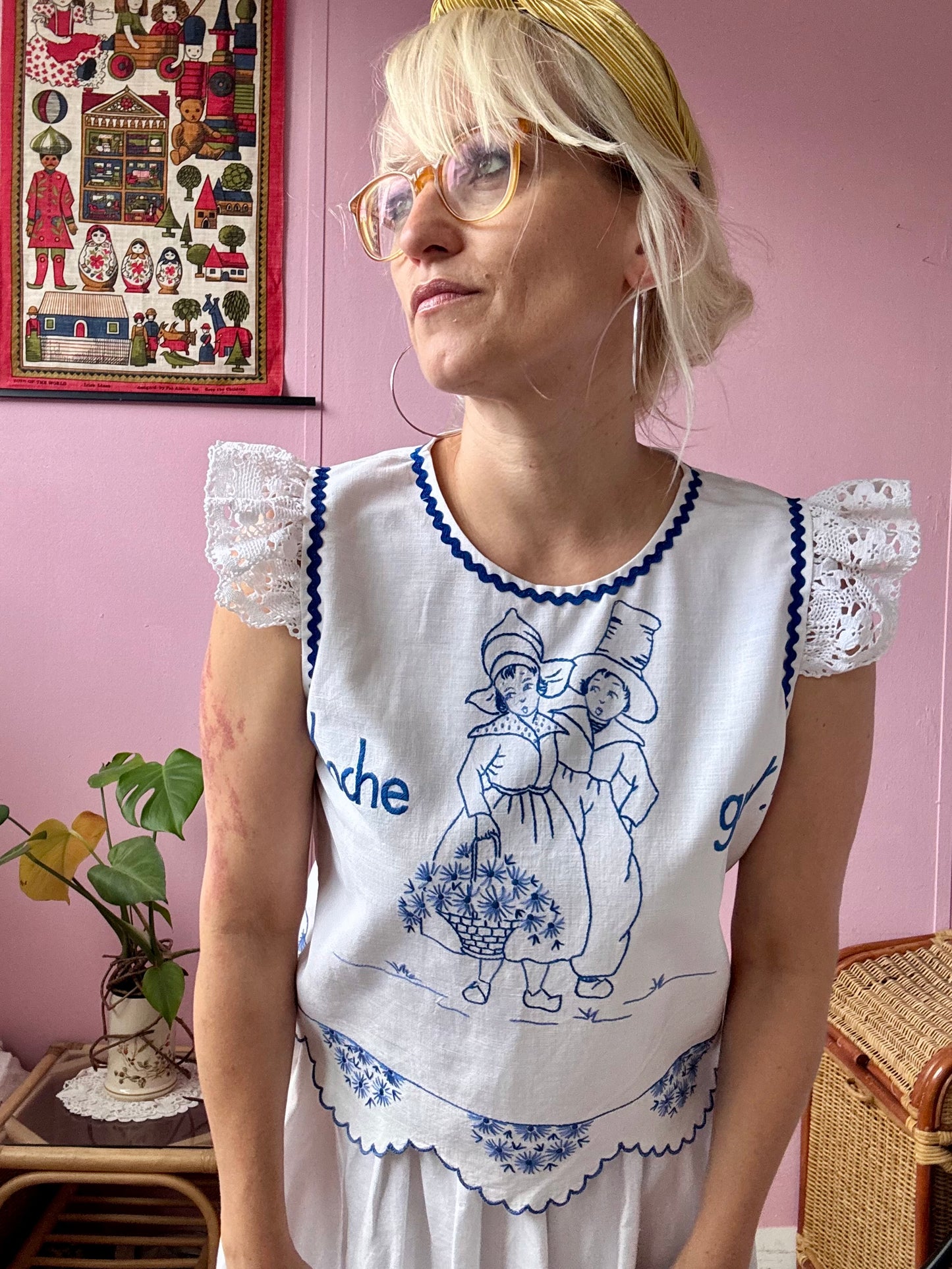 White top with blue hand embroidery