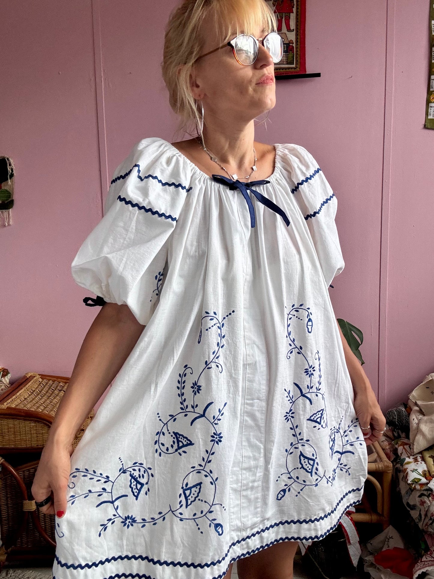 White mini dress with blue embroidery and blue bows