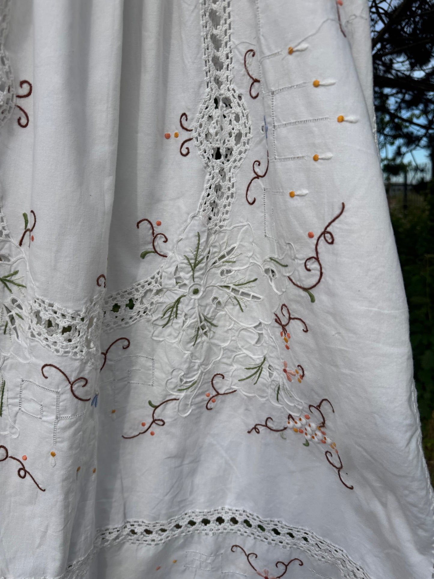 White maxi dress with embroidery and lace