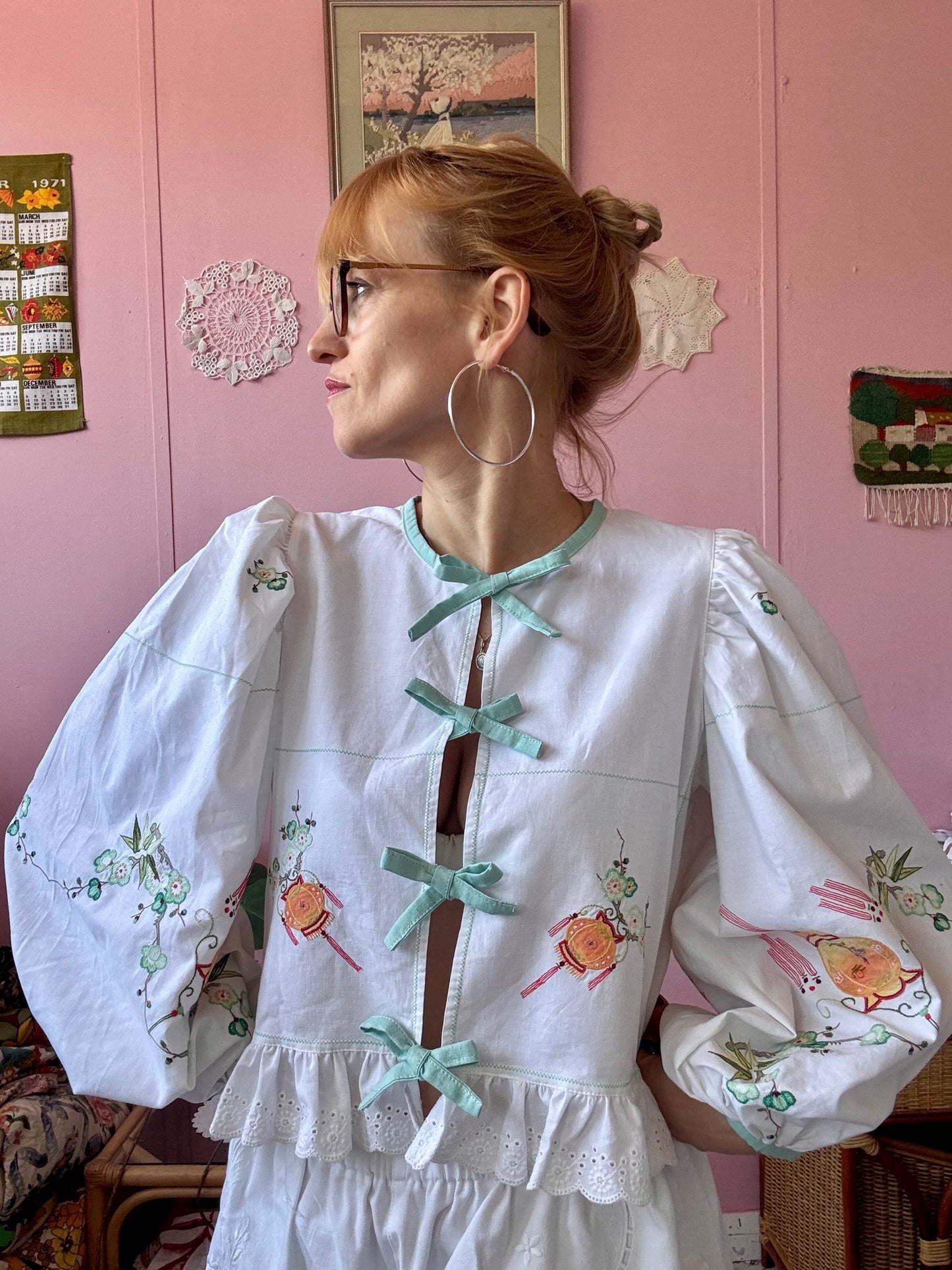 Embroidery and appliqués blouse with light green bows