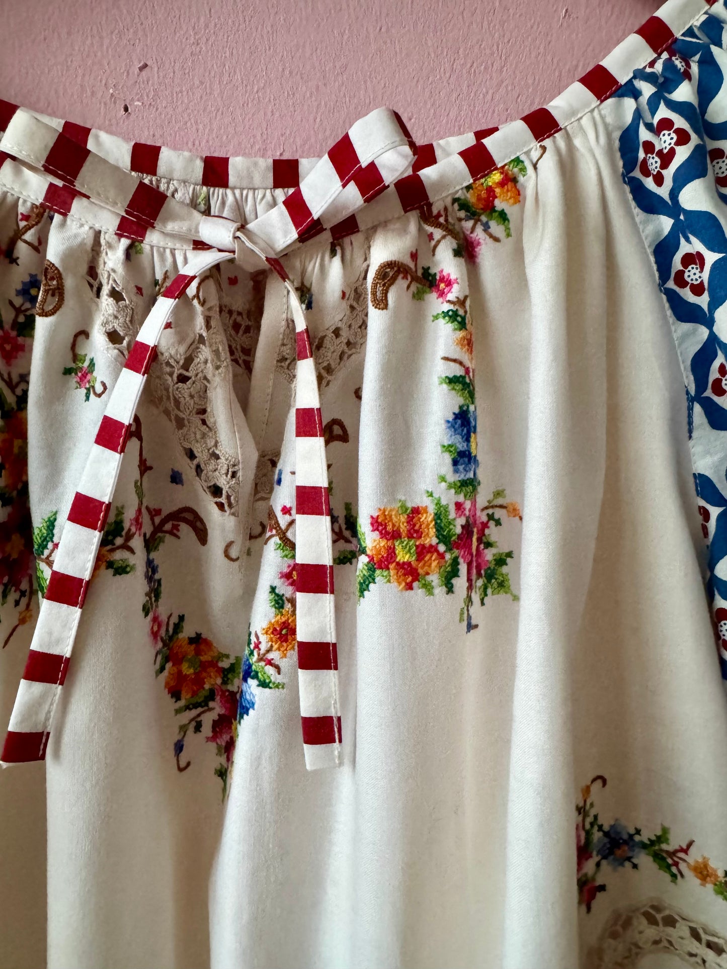 Embroidery and lace blouse with red stripes binding