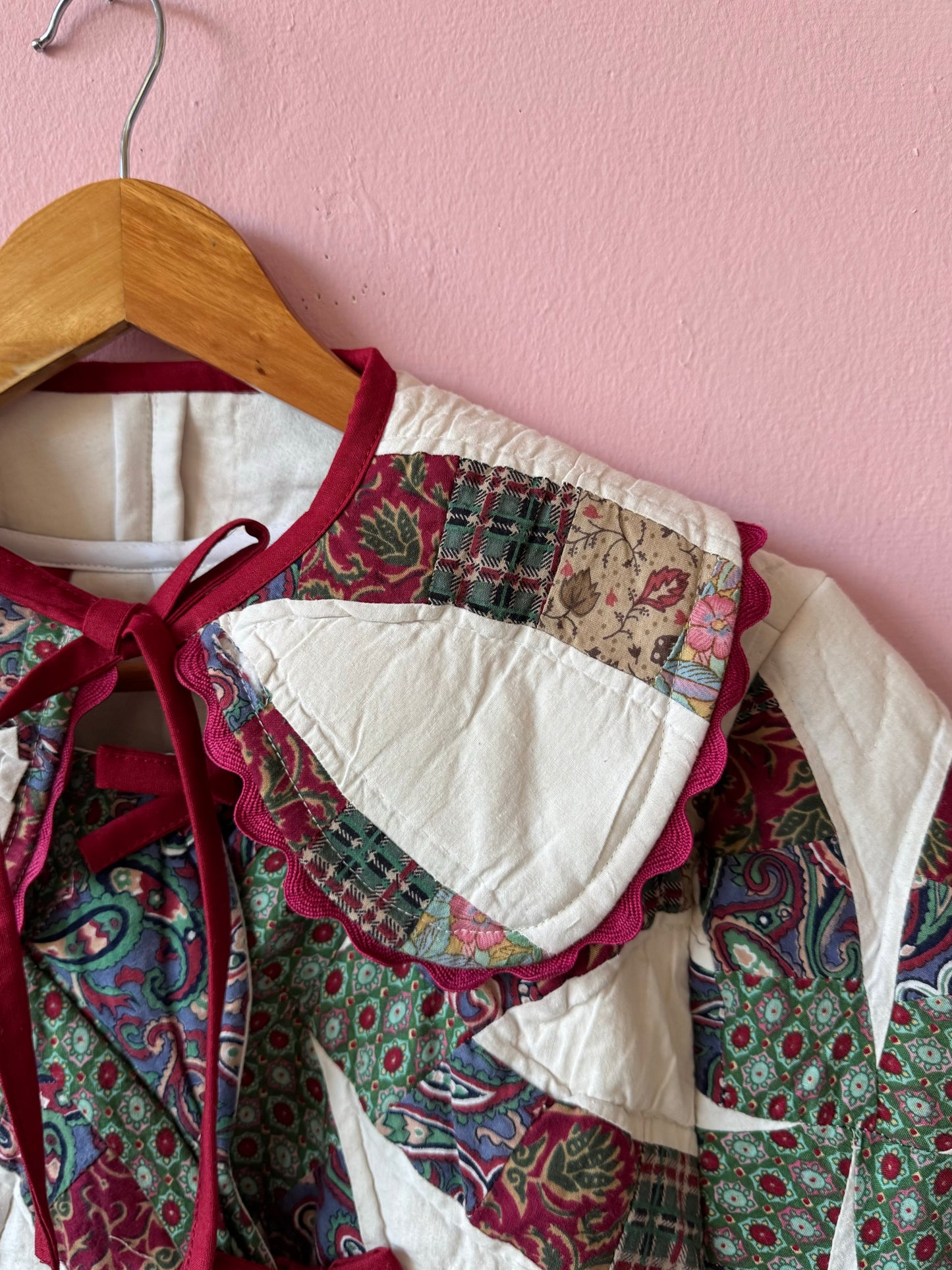 Patchwork jacket with burgundy ric rac and bows