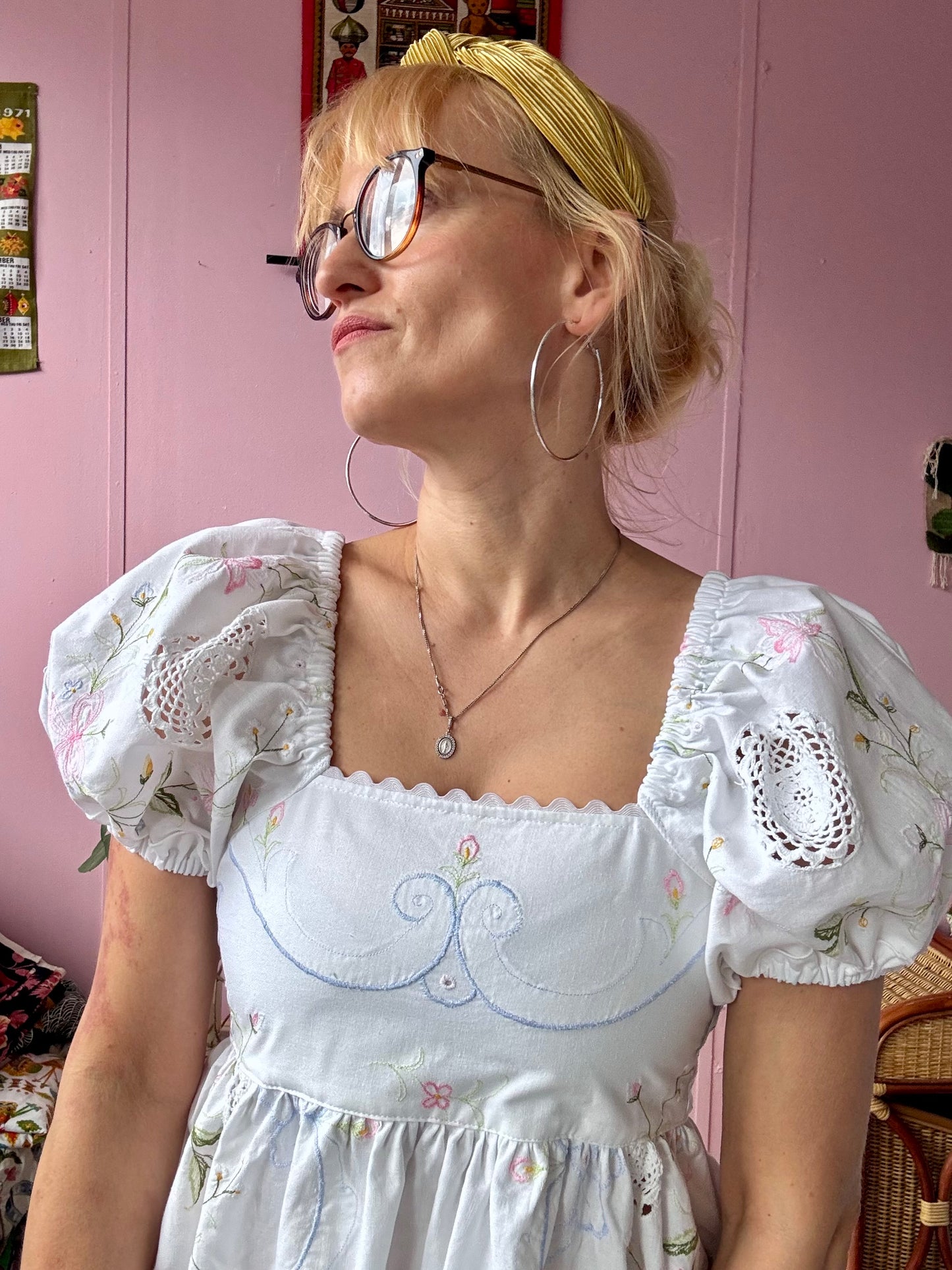 White maxi dress with floral embroidery and puffy sleeves