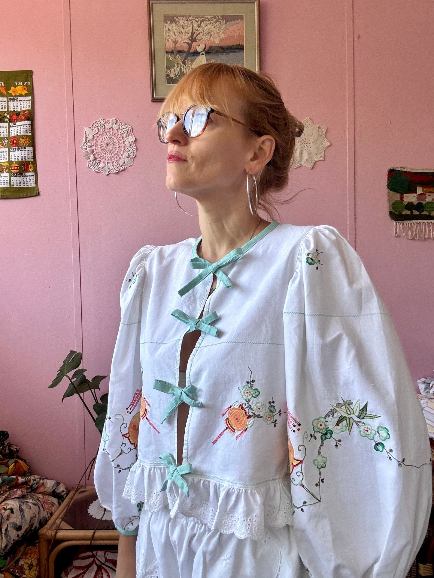 Embroidery and appliqués blouse with light green bows