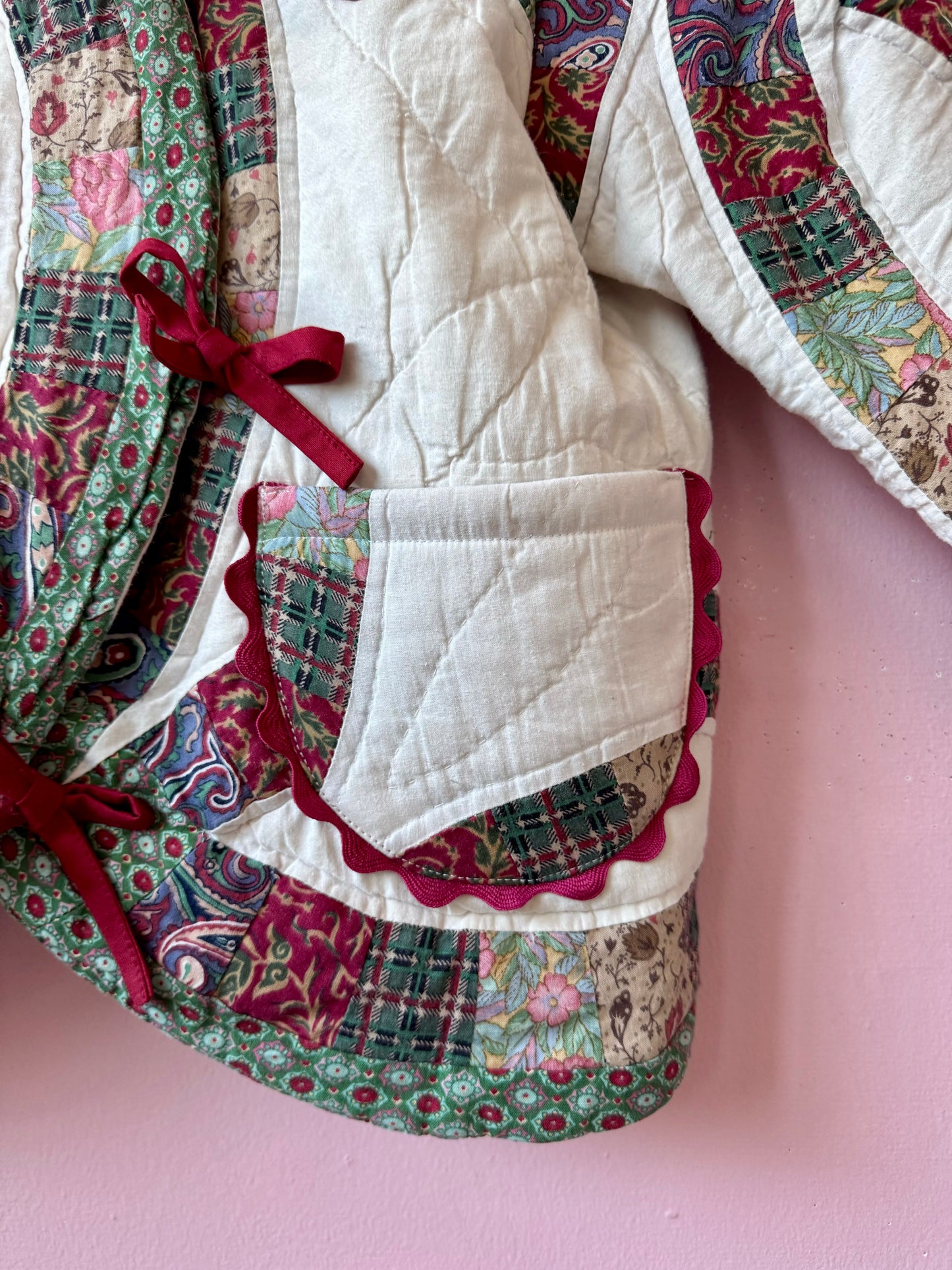 Patchwork jacket with burgundy ric rac and bows