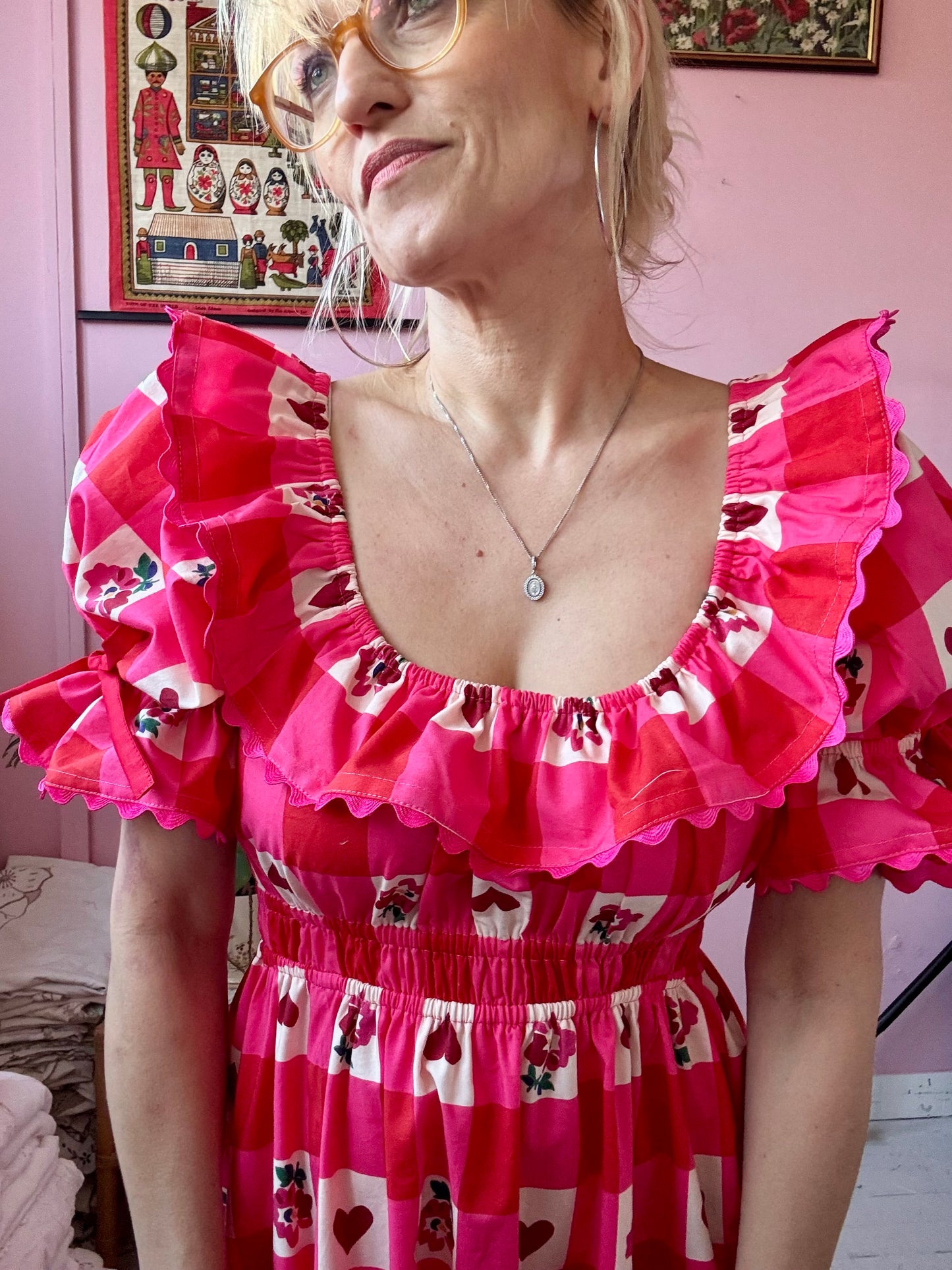 Pink/red dress with frills and ric rac