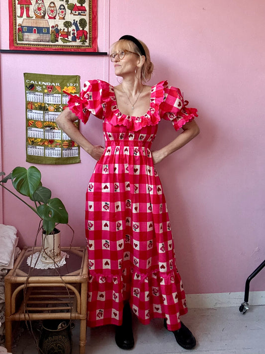 Pink/red dress with frills and ric rac