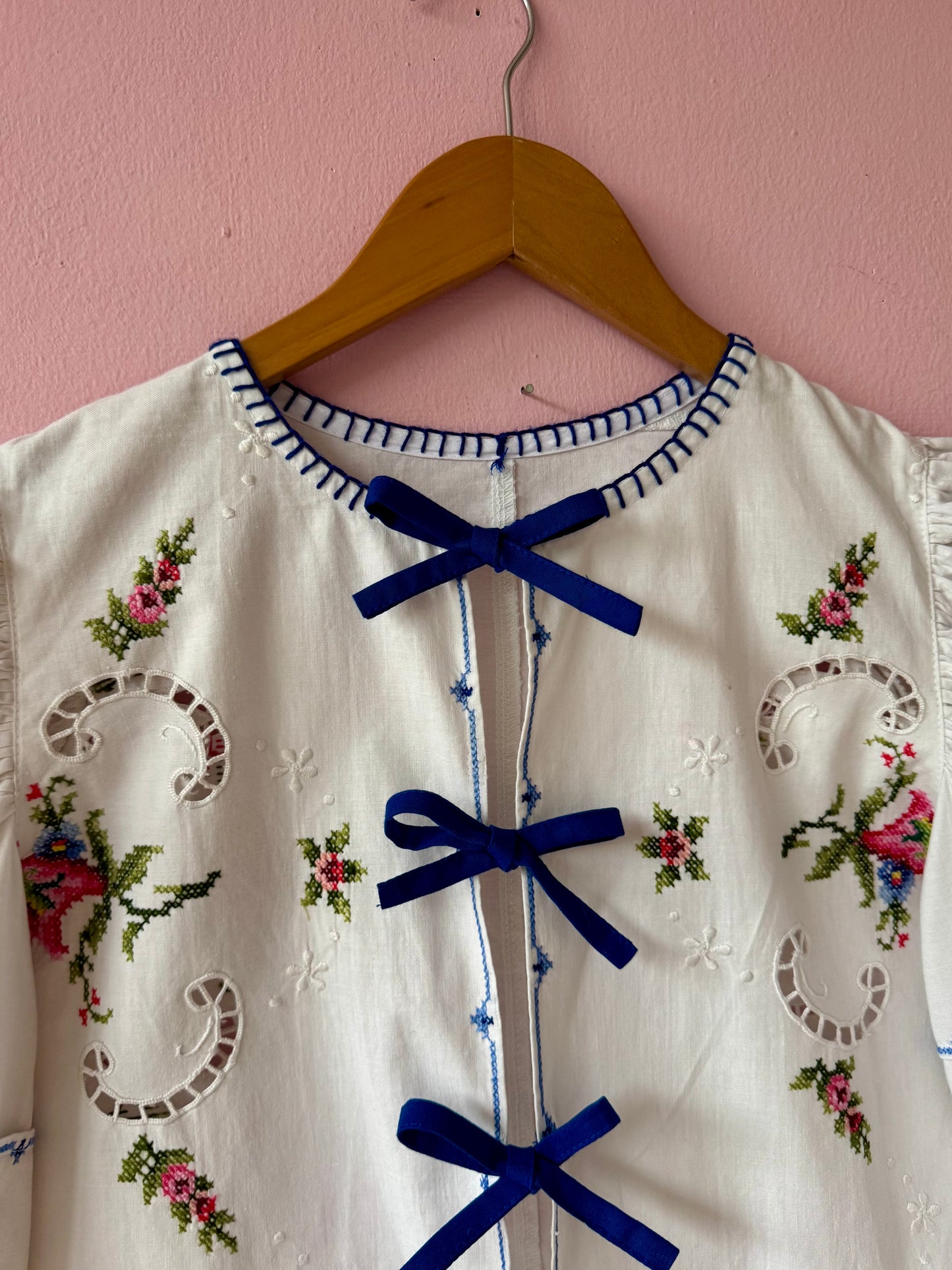 White embroidery blouse with blue bows
