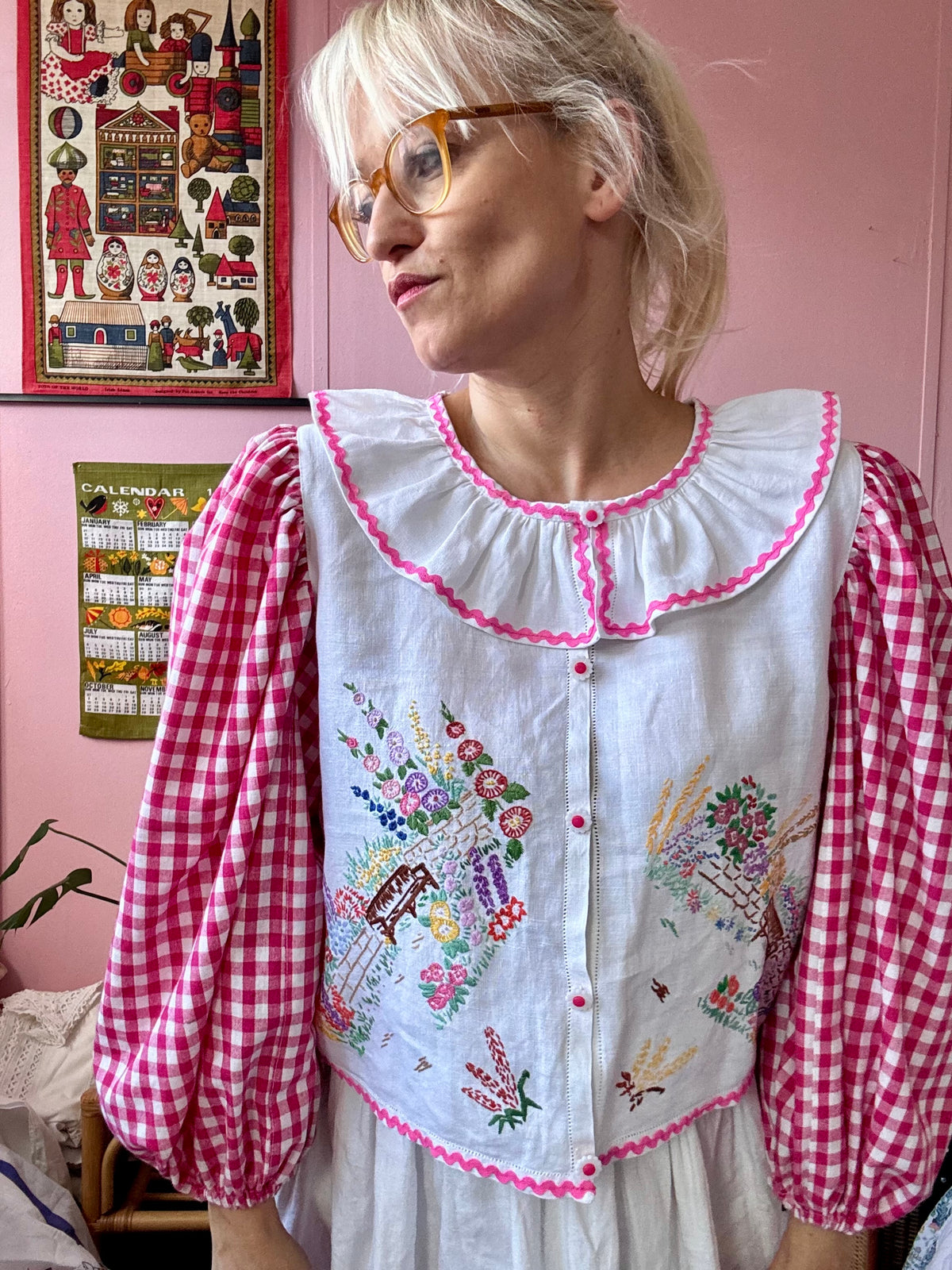Pink gingham and floral blouse with neckline frill