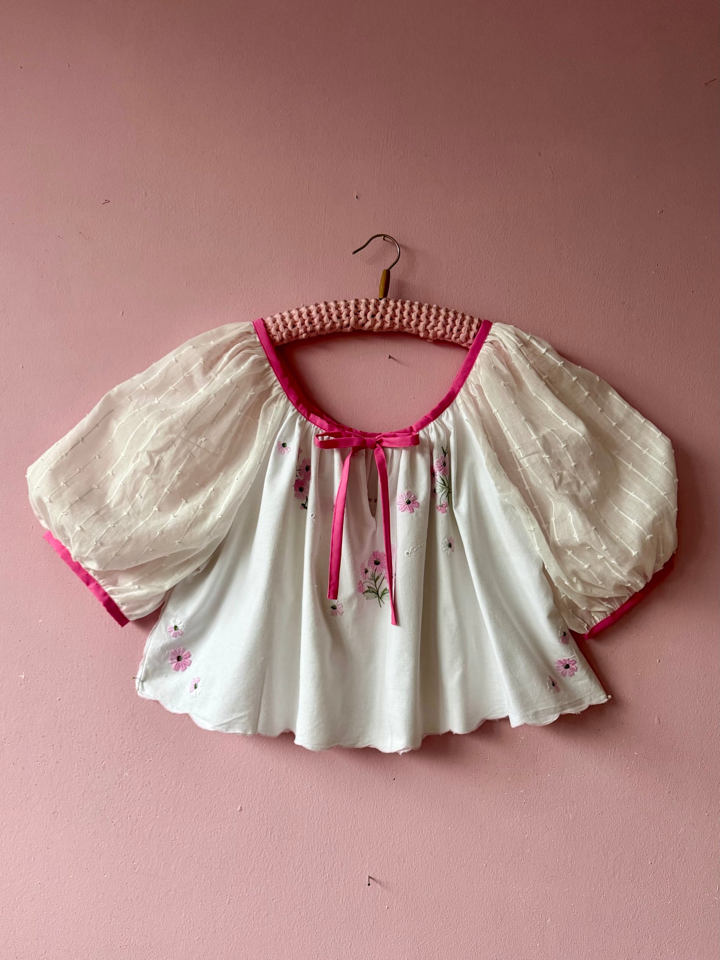 White blouse with pink binding